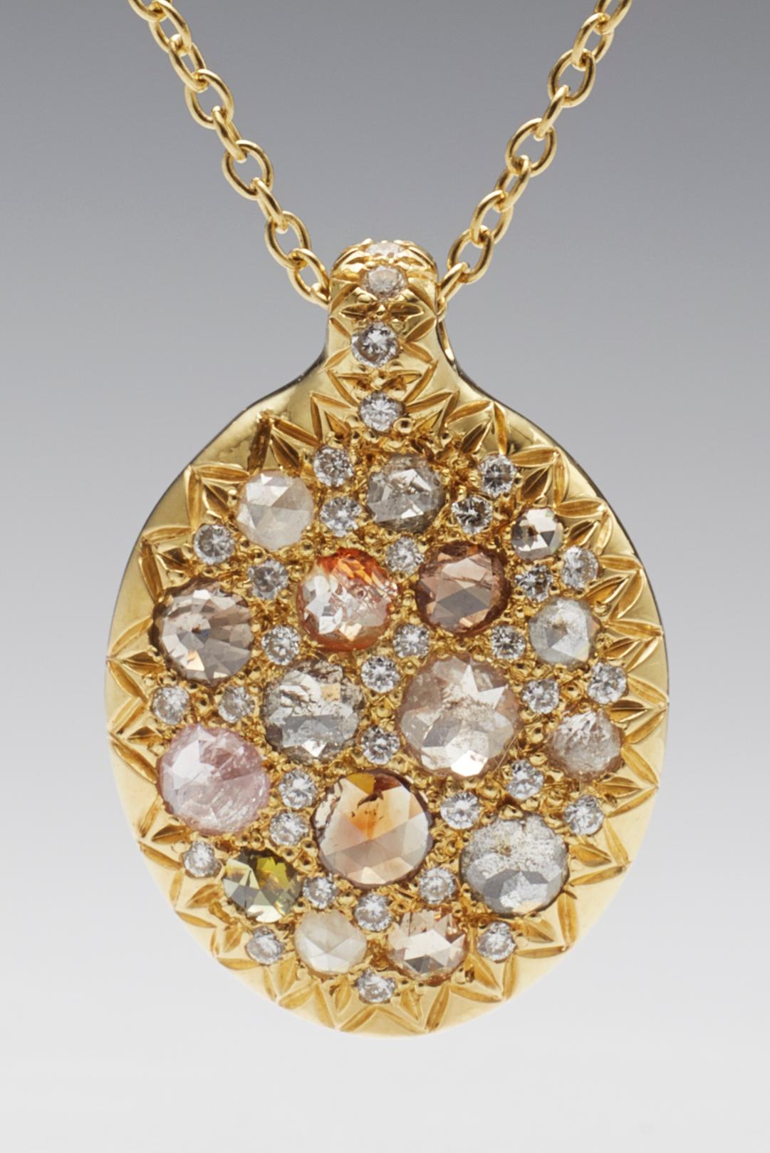 Rose cut natural multi color pave diamond pendant. One of a kind, hand crafted by jeweler Christopher Phelan. 48 VS diamonds total weight 1.17 carats. 18K Gold.
Pendant diameter .75 x .50 inches. Length of necklace 16 inches.