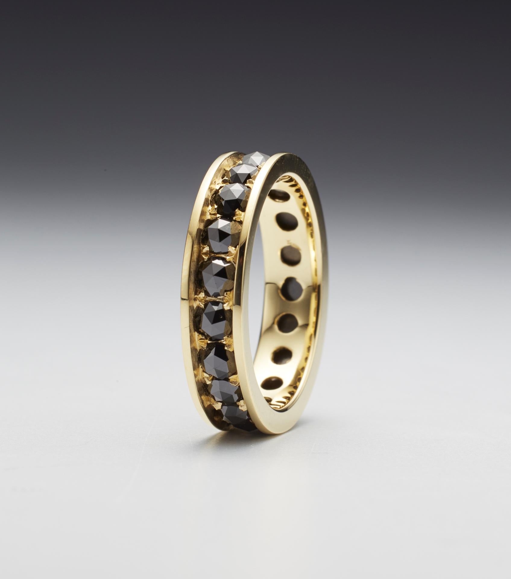 Black rose cut diamond eternity ring in 18-karat gold by artist Christopher Phelan.
Diamond weight, 2 carats, 3mm black diamonds. 
Ring size: 7
Width of ring: 4.75 mm.