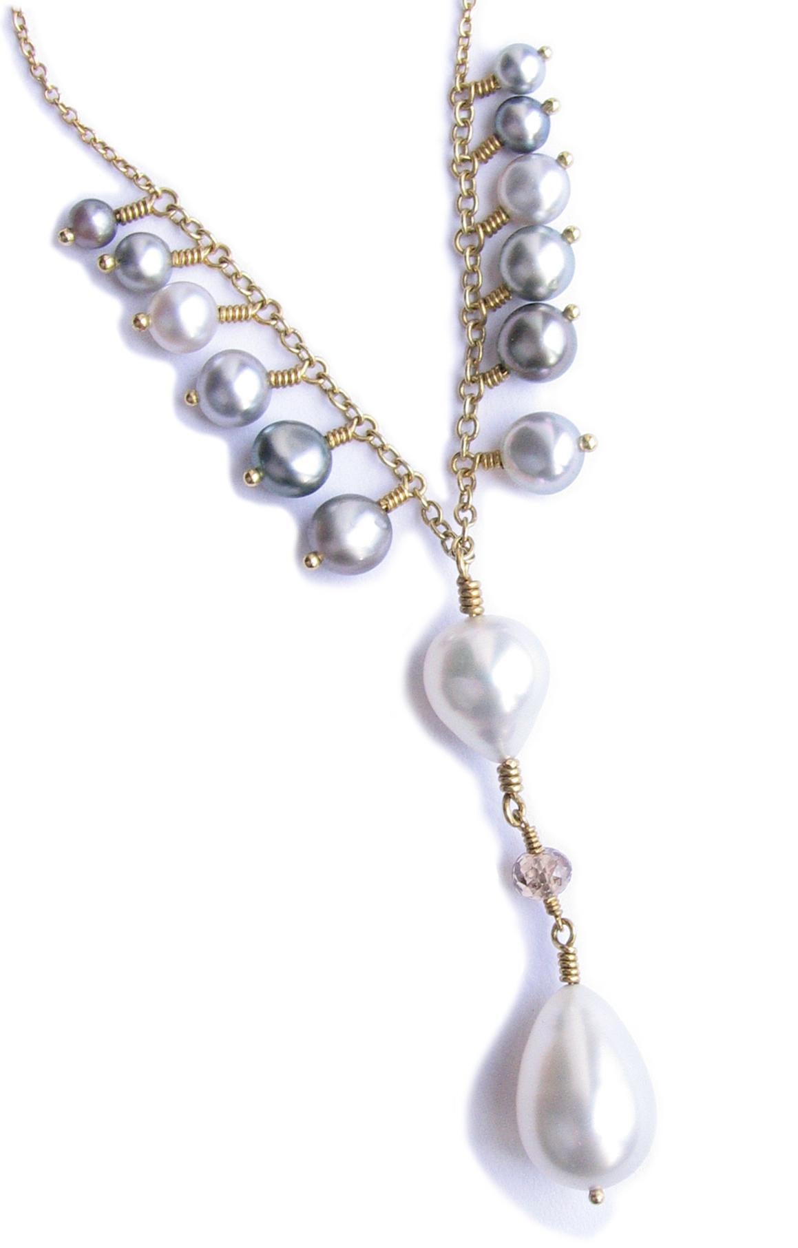 South sea keshi pearl and diamond necklace. One of a kind hand made in 18K gold. Length of necklace 17 inches.
Pearl quality and details: White south sea size 14 X 9 , 9 X 8 millimeter.
Accented with natural south sea keshi pearls 5 millimeter each.