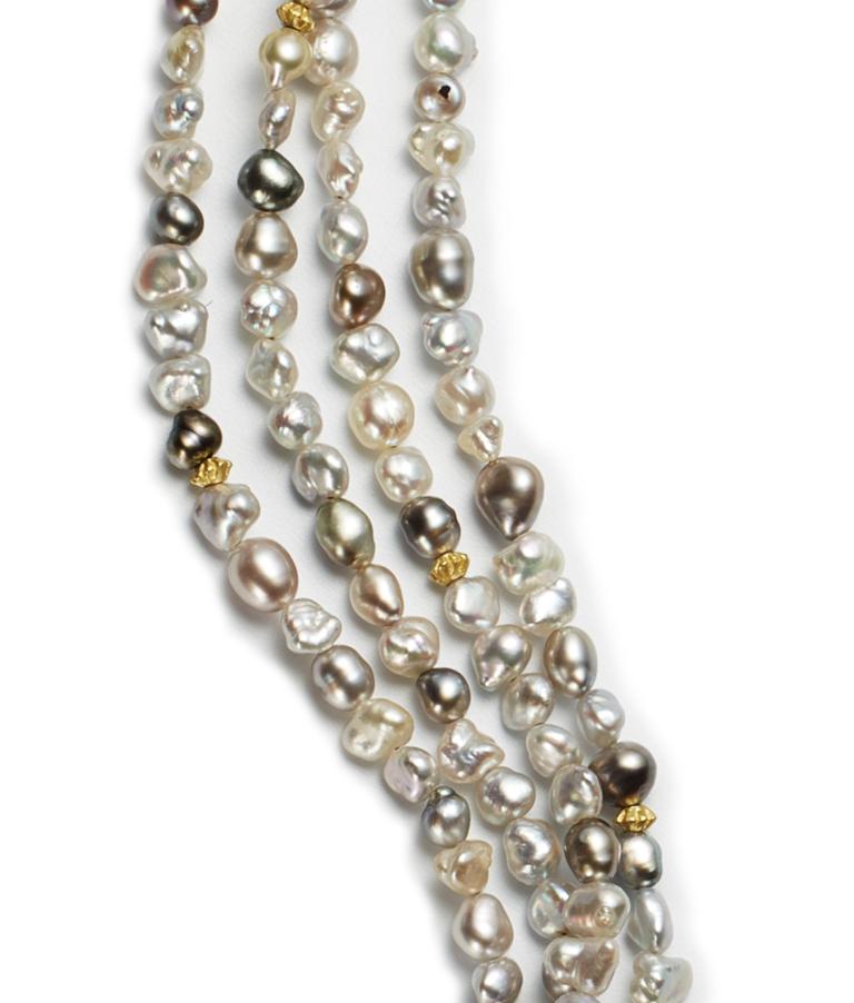 Natural keshi south sea pearl 18 karat gold necklace. Necklace is accented with 18k gold beads. Length adjustable to 18, 18 ½, 19, 20 inches. 
Pearl quality and details: AAA quality natural south sea keshi pearls. Approximate size of pearls is 3.5