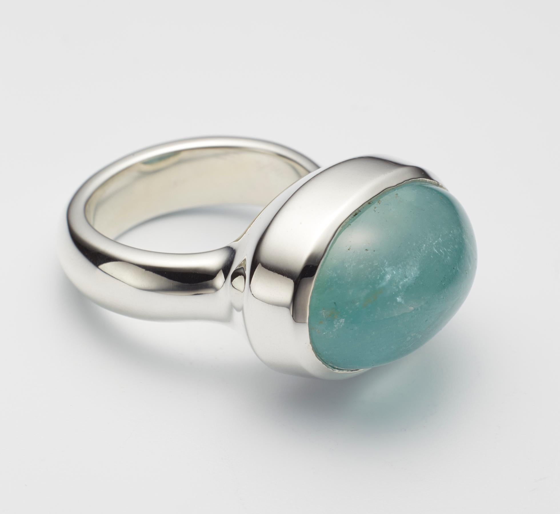One of a kind aquamarine cabochon sterling silver ring, hand made by jeweler Christopher Phelan.
Aquamarine cabochon size 20 x 15 millimeter.
Width of band 5.6 millimeter.
Ring size 6.
