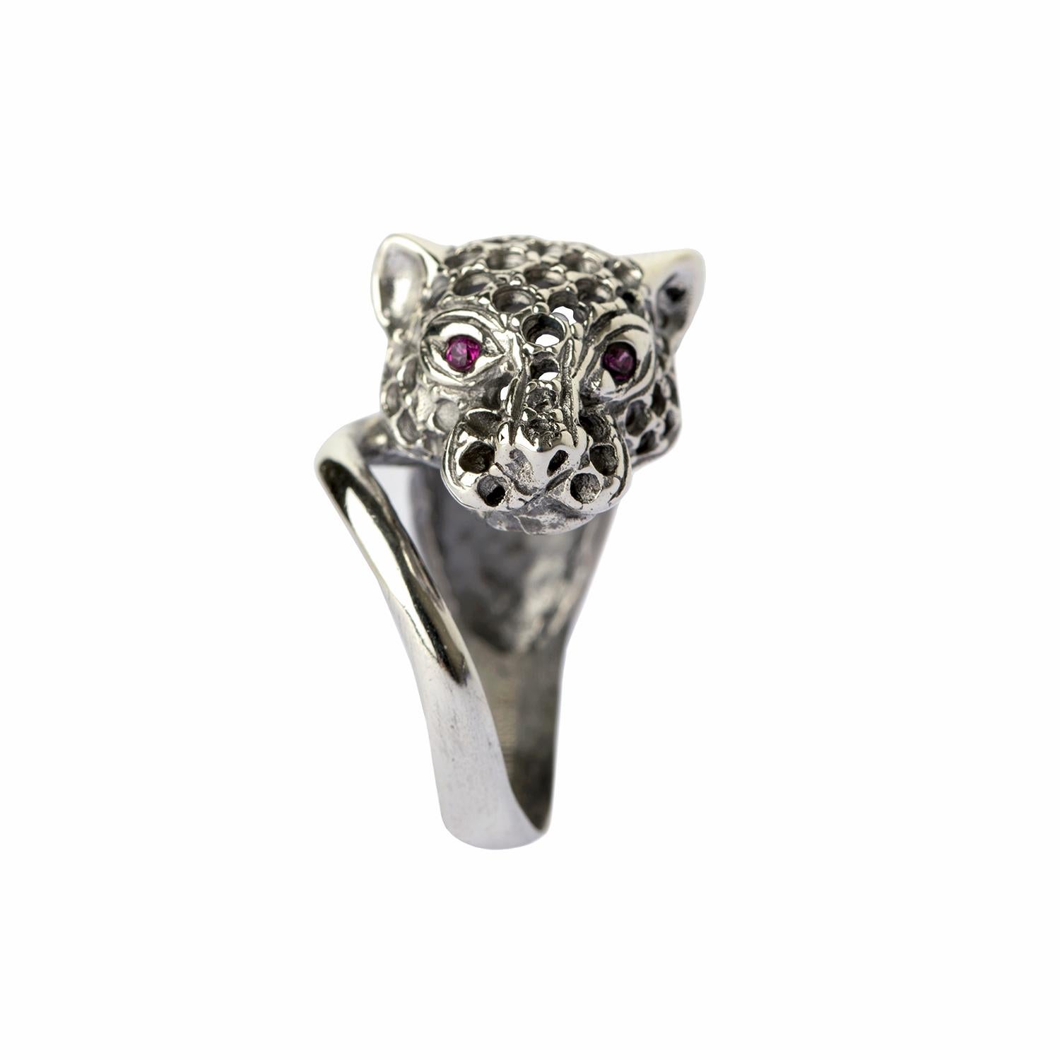 The quintessential icon of Iosselliani, the Panther's head refresh the idea of the engagement ring with its intriguing animal-inspired look. Hand crafted in antique silver, the ring is encrusted with red zircon as the panther's eyes. Wear it by