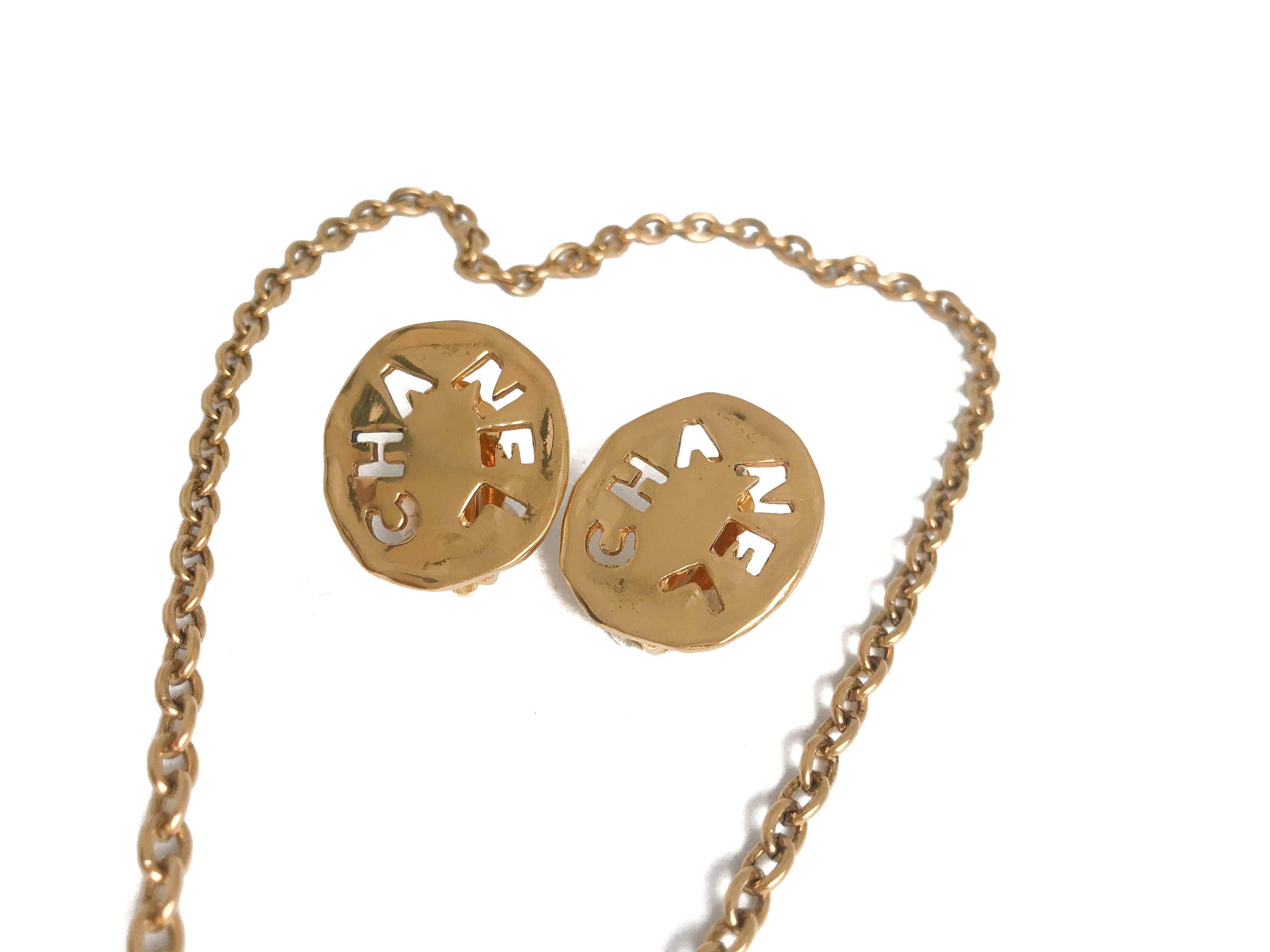 Contemporary Chanel 1980s Vintage 18 Karat Gold Plated Logo Necklace and Clip On Earrings Set