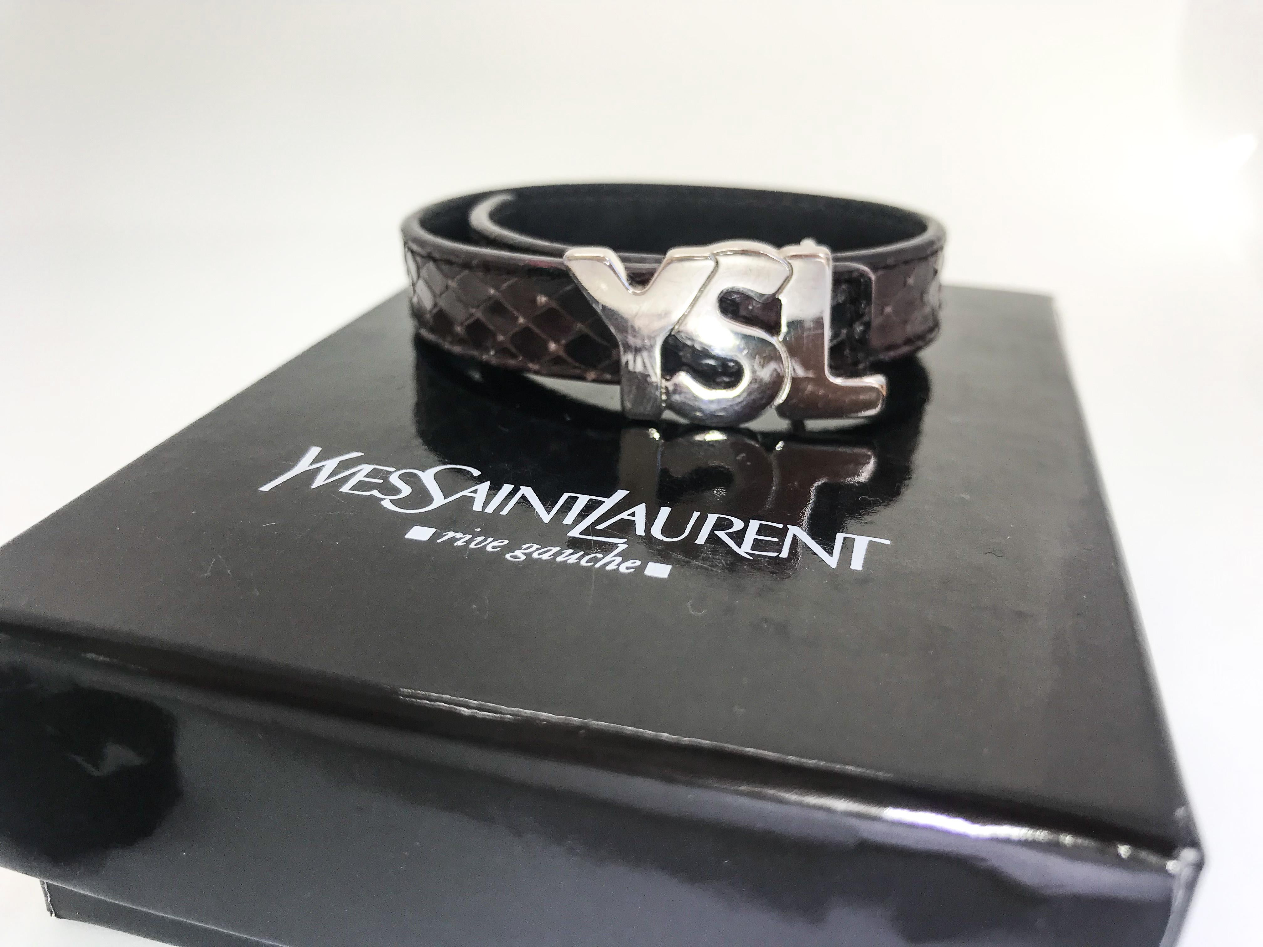 YSL Leather Snakeskin effect Bracelet with logo.

The silver-toned buckle on this adjustable, leather bracelet is a modern take on the classic Yves Saint logo.

Adjustable - 7.5 - 8.5 inches

Size Medium.  Made in Italy

Barcode - EPPY200766B

It