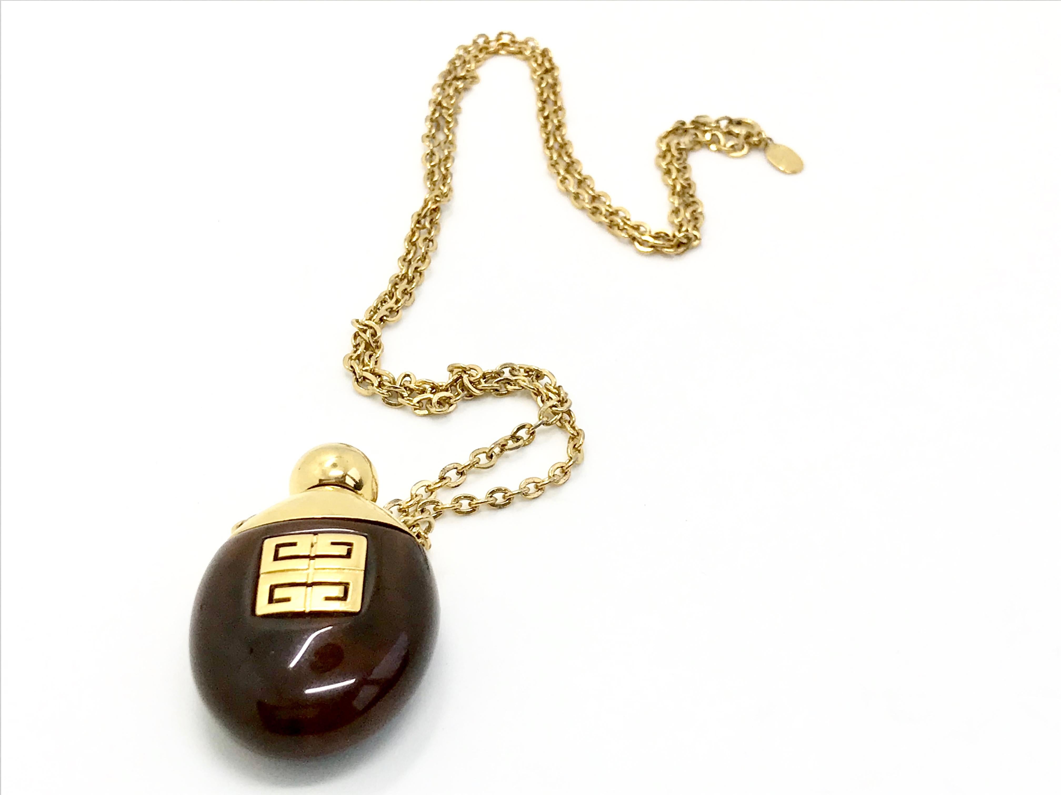 Givenchy 1977 vintage faux tortoiseshell perfume bottle necklace.  In Good Condition In London, GB