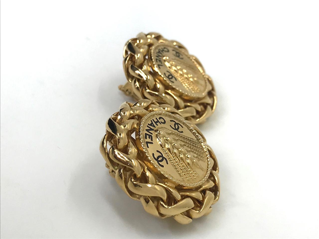 Chanel 1980s vintage gold plated CC logo clip on earrings with rare wheat design. Features both the chanel name and CC logo on each earring.  Stamped 'chanel' on the reverse.  This is a stamp which was used on a select number of pieces in the 70s