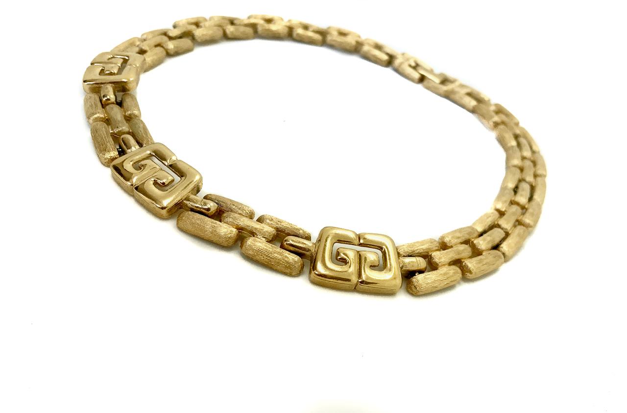 Givenchy 1980s Vintage Gold Plated 'G' Choker Collar Necklace.  Featuring the iconic double G Givenchy logo. 

This rare statement find comes from the iconic Parisian House of Givenchy. 
Fully signed and authenticated.
  
15.5 inches long x 0.5