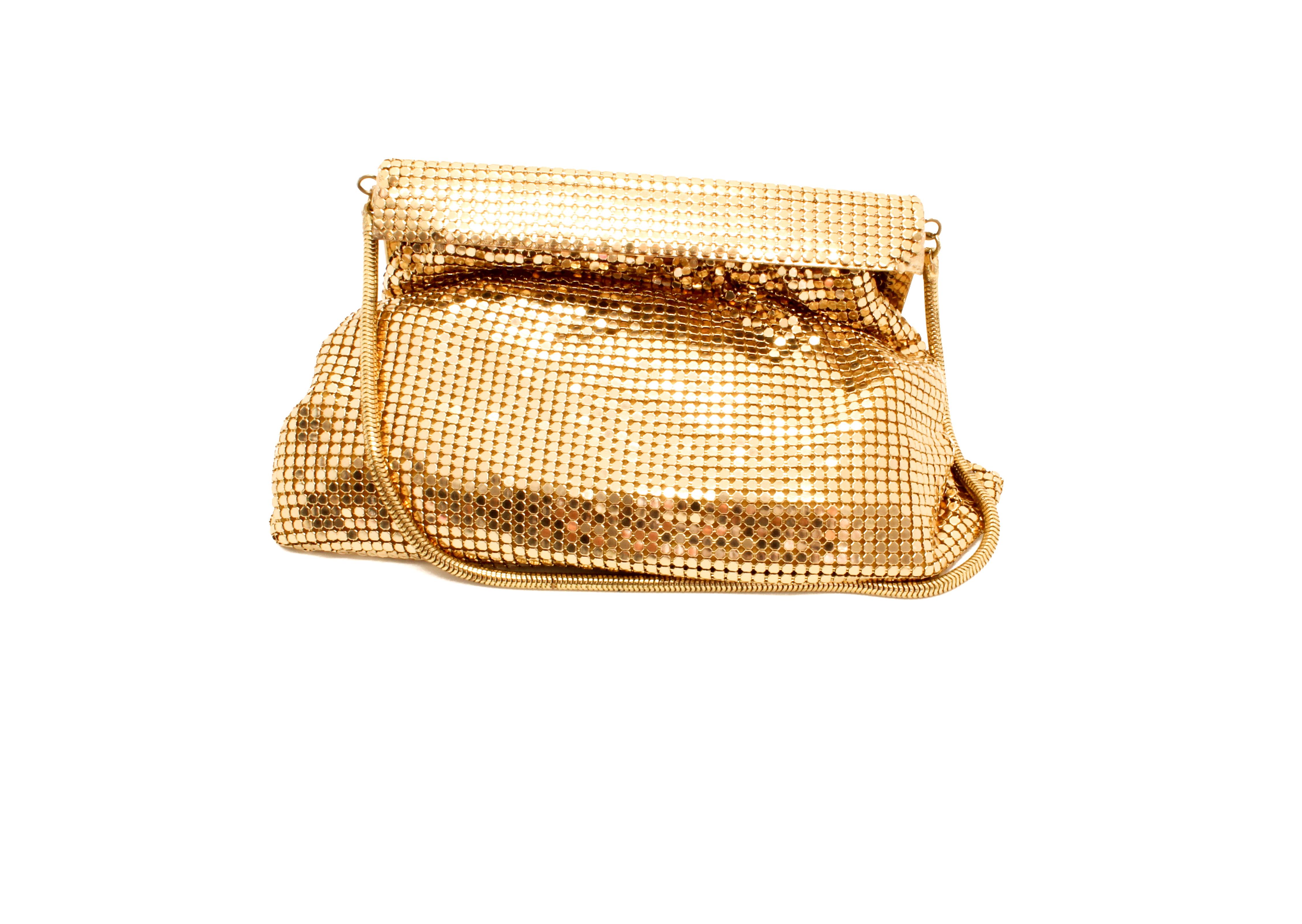 Whiting & Davis 1970s Vintage Gold Tone Mesh Evening Bag.

In 1892, Charles Whiting wove by hand the first Whiting & Davis handbag, transforming the ancient art of chainmail into a fabric.  Whiting & Davis' original accessories were hugely popular