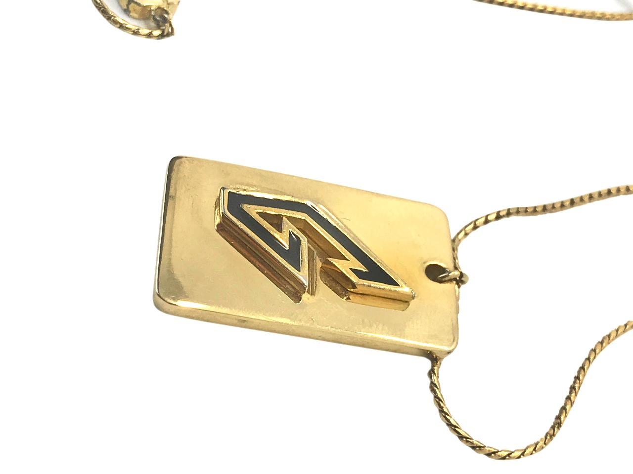 Givenchy 1970s (1979) Gold Plated G Logo Pendant Necklace.

This is a rare design from Givenchy's vintage heyday from 1977-1981 when quality was at it's best and every design oozed Studio 54 chic.  

Stamped Givenchy and dated on reverse of pendant
