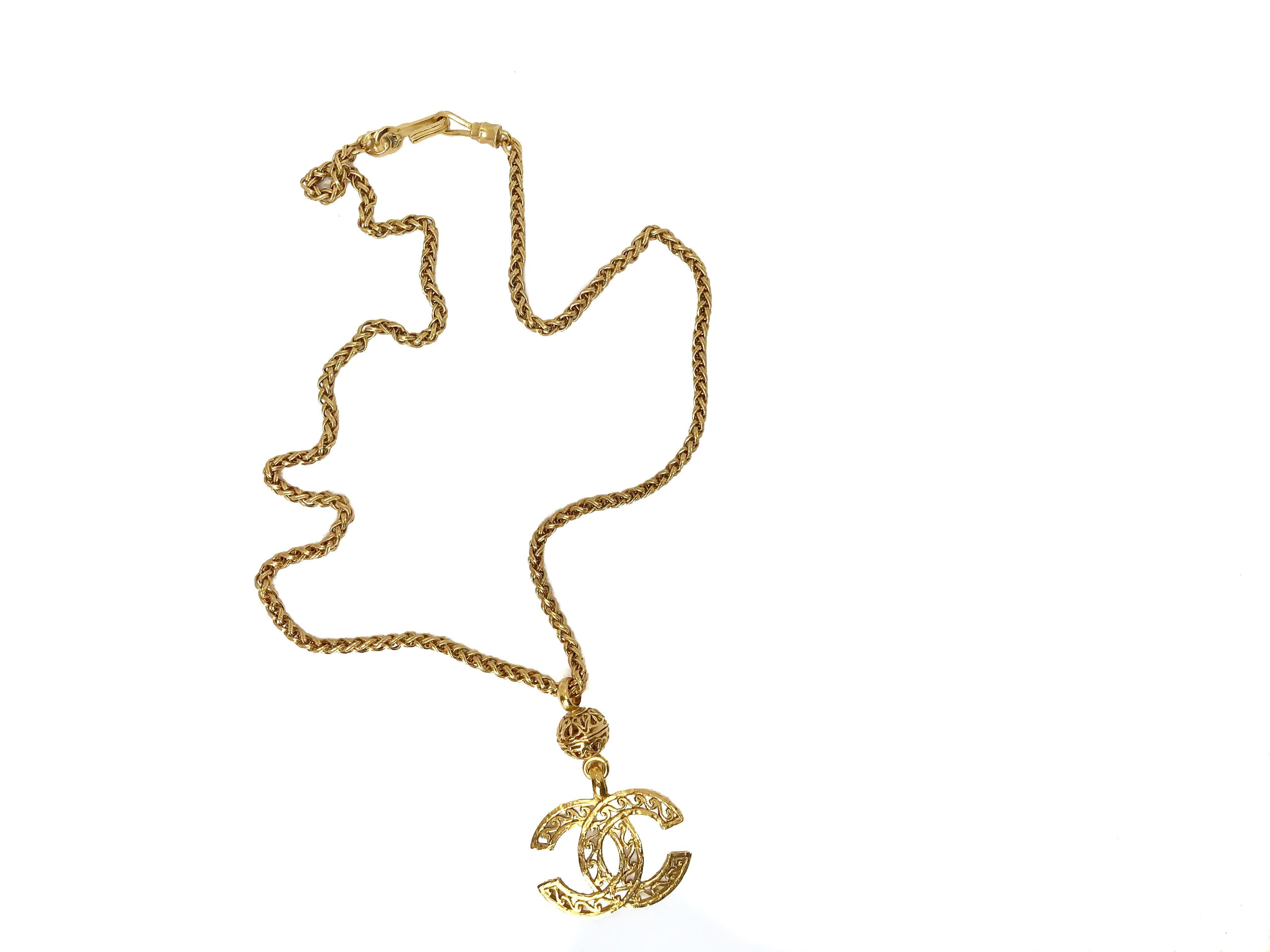 Chanel 90s Vintage CC Gold Plated Pendant Necklace on Chunky Chain.  From the 1995 Autumn Winter collection.

The chain is chunky and weighty, featuring a large open work CC logo suspended from a fabulous sphere.  A real head turning piece for the
