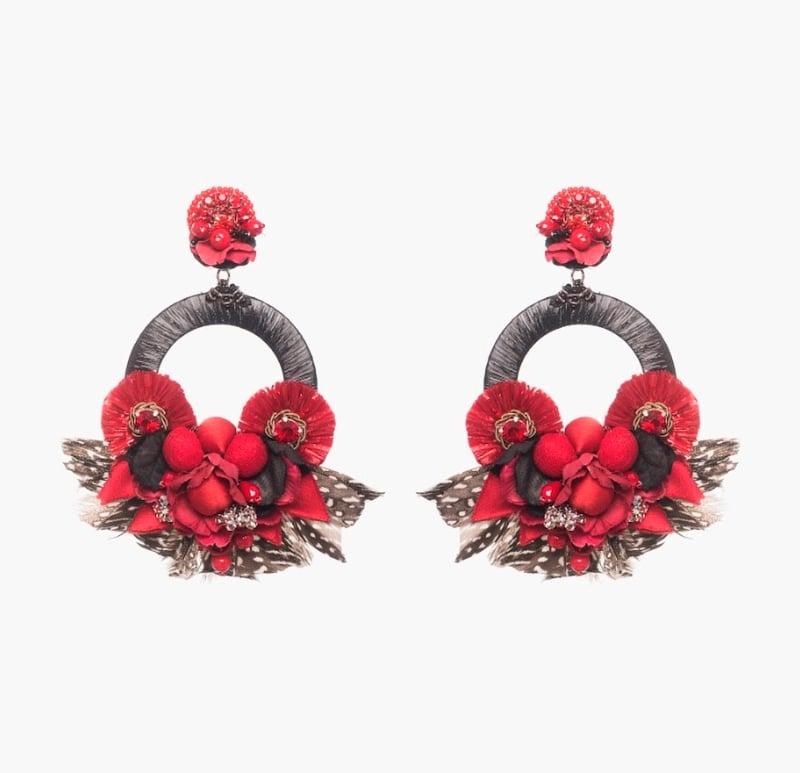 Be bold in the Ipanema earring. Genuine Raffia, silk-covered pompoms, and guinea feathers creative a festive feeling for every wardrobe. 