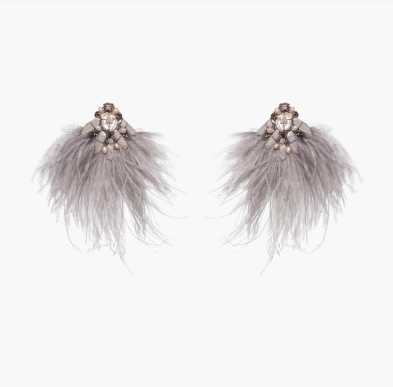 Make a bold statement in the Niteroi earring. Large ostrich feathers and Mother-of-Pearl add an air of sophistication perfect for any occasion. 