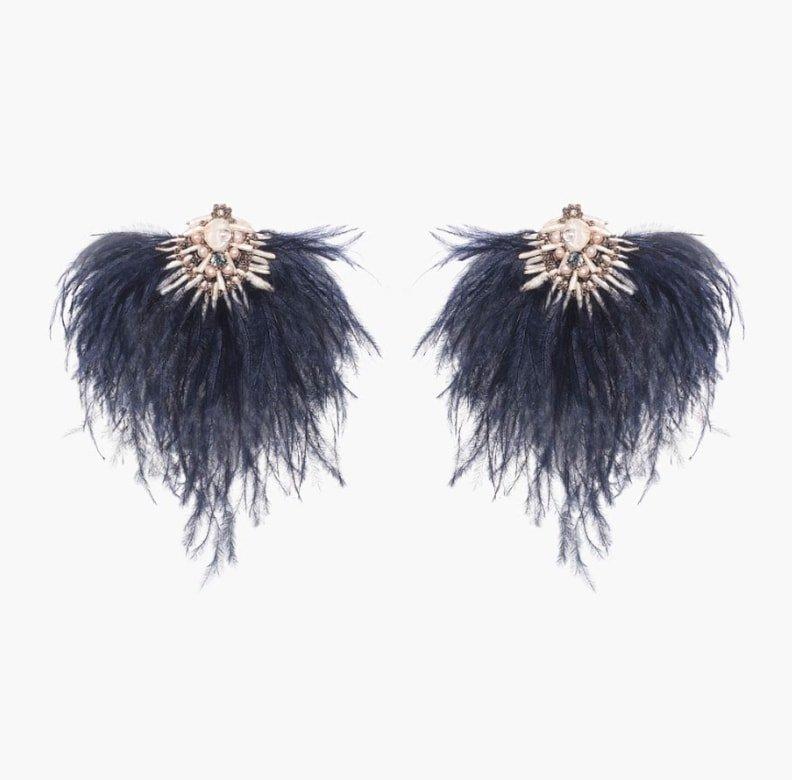 Make a bold statement in the Niteroi earring. Large ostrich feathers and Mother-of-Pearl add an air of sophistication perfect for any occasion. 