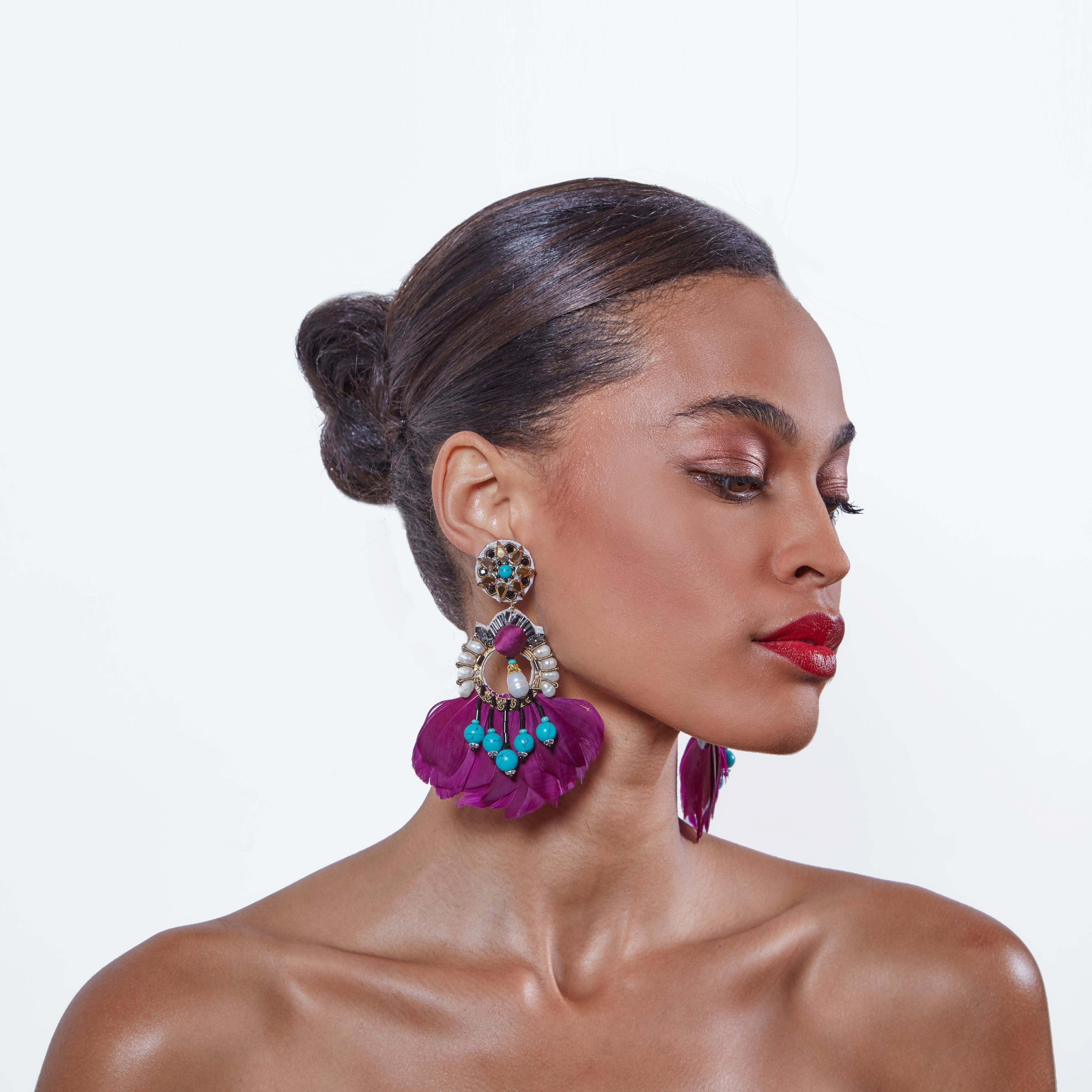  Rich purple feathers, turquoise, and Mother-of-Pearl create lively color for any look.
