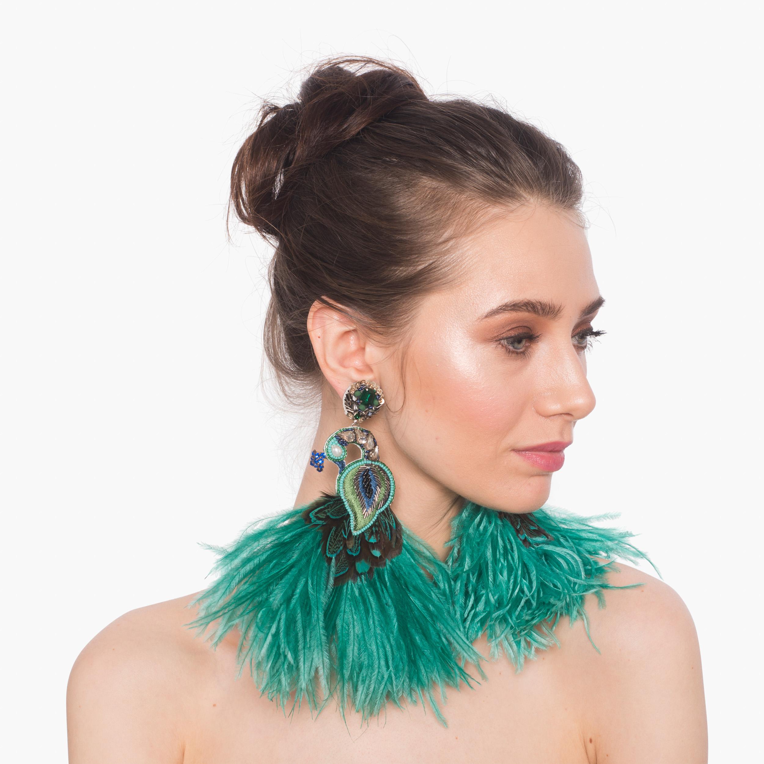 Be bold in the Corcovado earring. Crystals and large ostrich feathers make an extravagant statement for Fall. 