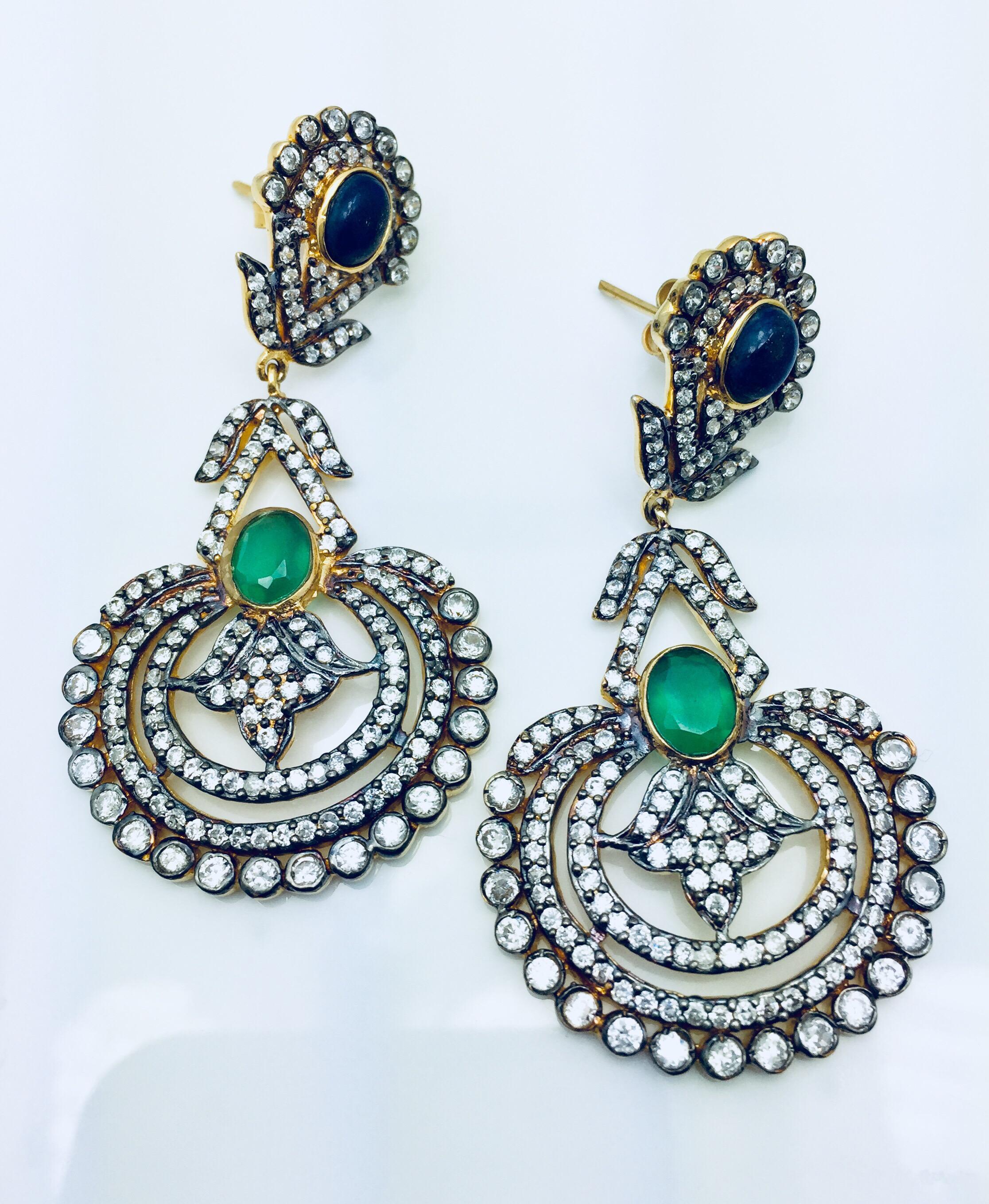 The Indian inspired design is ornate and lovely, the striking lapis and green quartz is enhanced by sparkling CZ stones. Earrings have a post closure for pierced ears.

A short video is available upon request.
Stone: Quartz, cubic zirconia
Length: 2