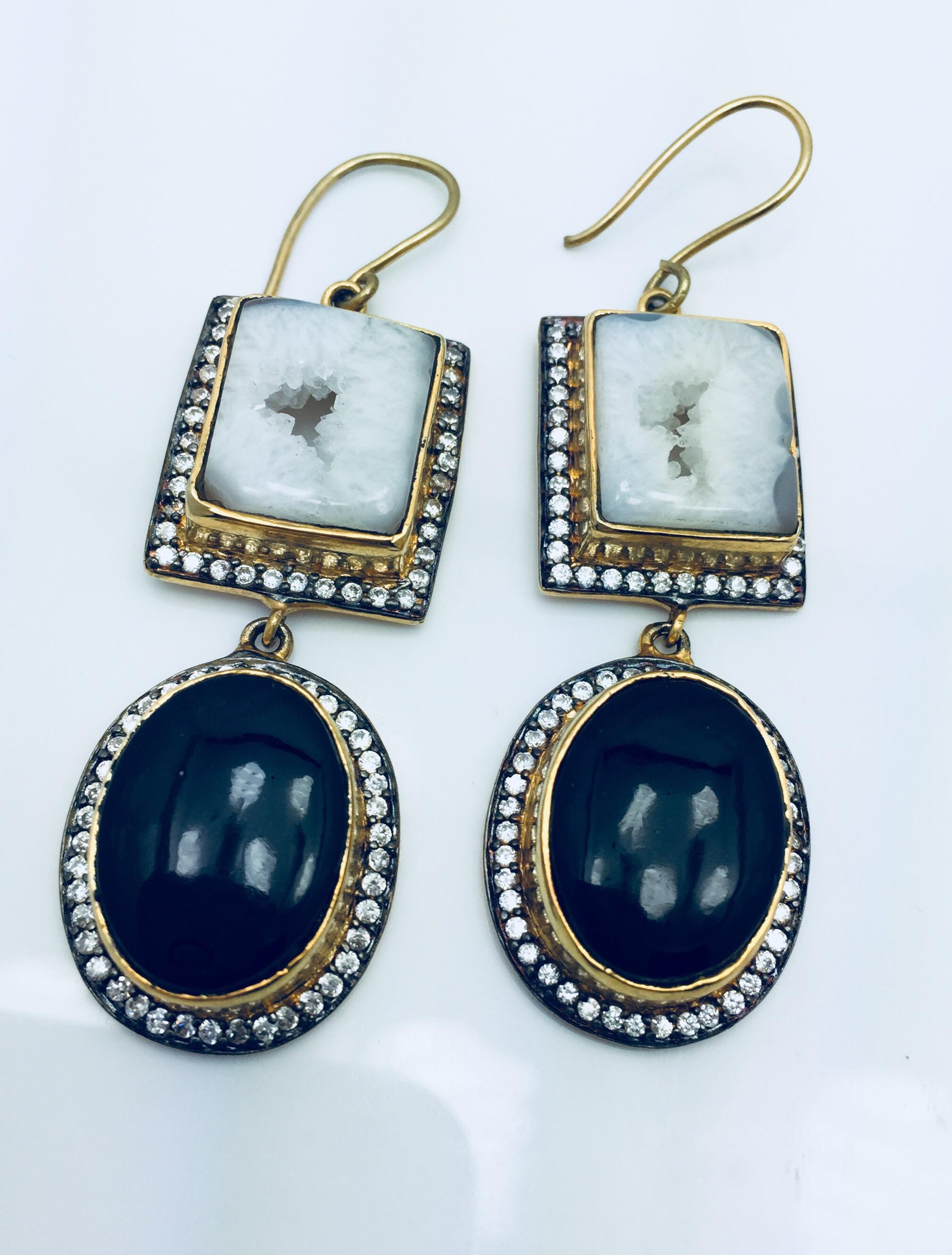Double Drop druzy earrings features slice geode in black and white.  Embellished with cubic zircon with fish hook closure.  Only 1 available.  18K Gold Plated.

FOLLOW  MEGHNA JEWELS storefront to view the latest collection & exclusive pieces. 