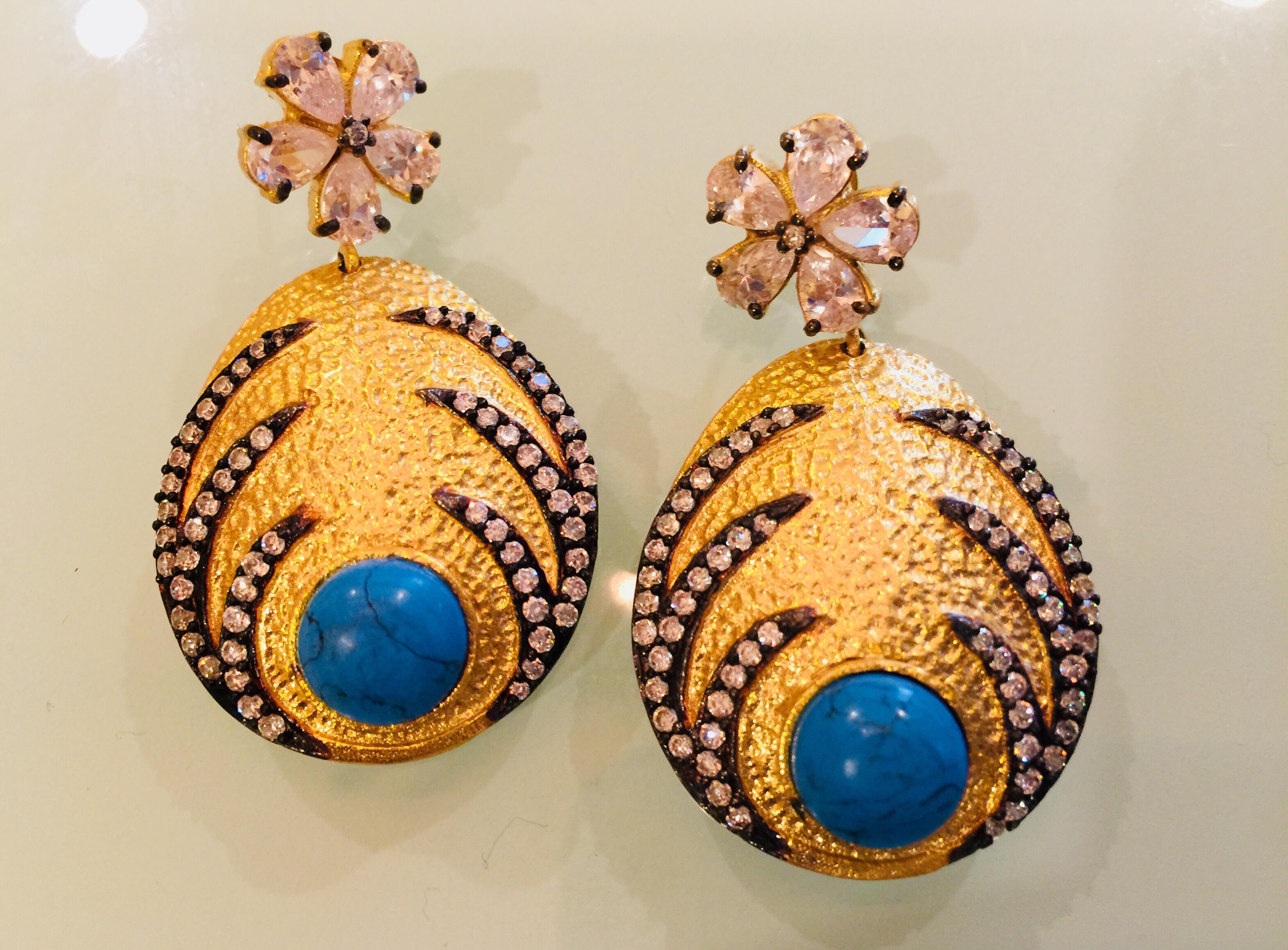 Hand brushed matte gold turquoise earrings featuring spiked crystal embellishments with clutch back closures.  Only 1 available

FOLLOW  MEGHNA JEWELS storefront to view the latest collection & exclusive pieces.  Meghna Jewels is proudly rated as a