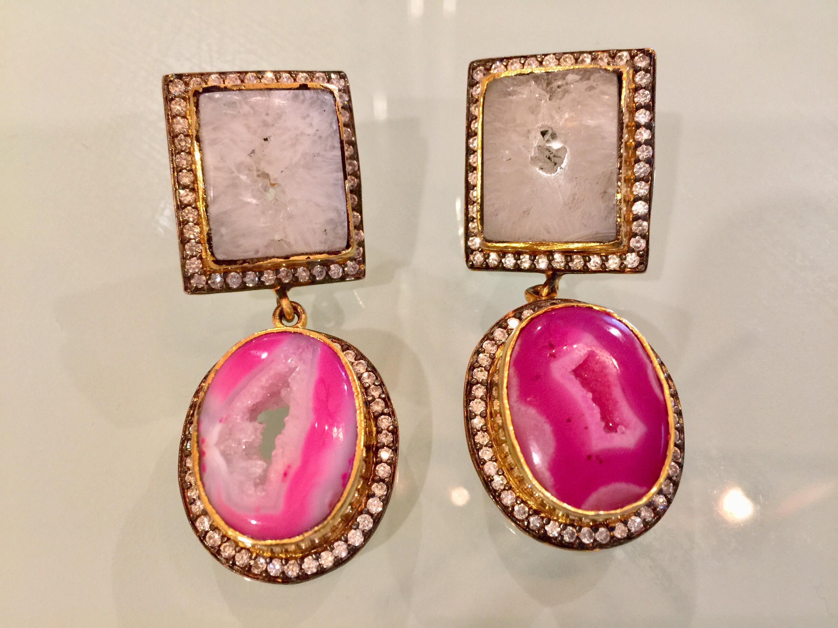 Double Drop druzy earrings features slice geode in pink and white.  Embellished with cubic zircon with clutch back closure.  Only 1 available.  18K Gold Plated.

FOLLOW  MEGHNA JEWELS storefront to view the latest collection & exclusive pieces. 