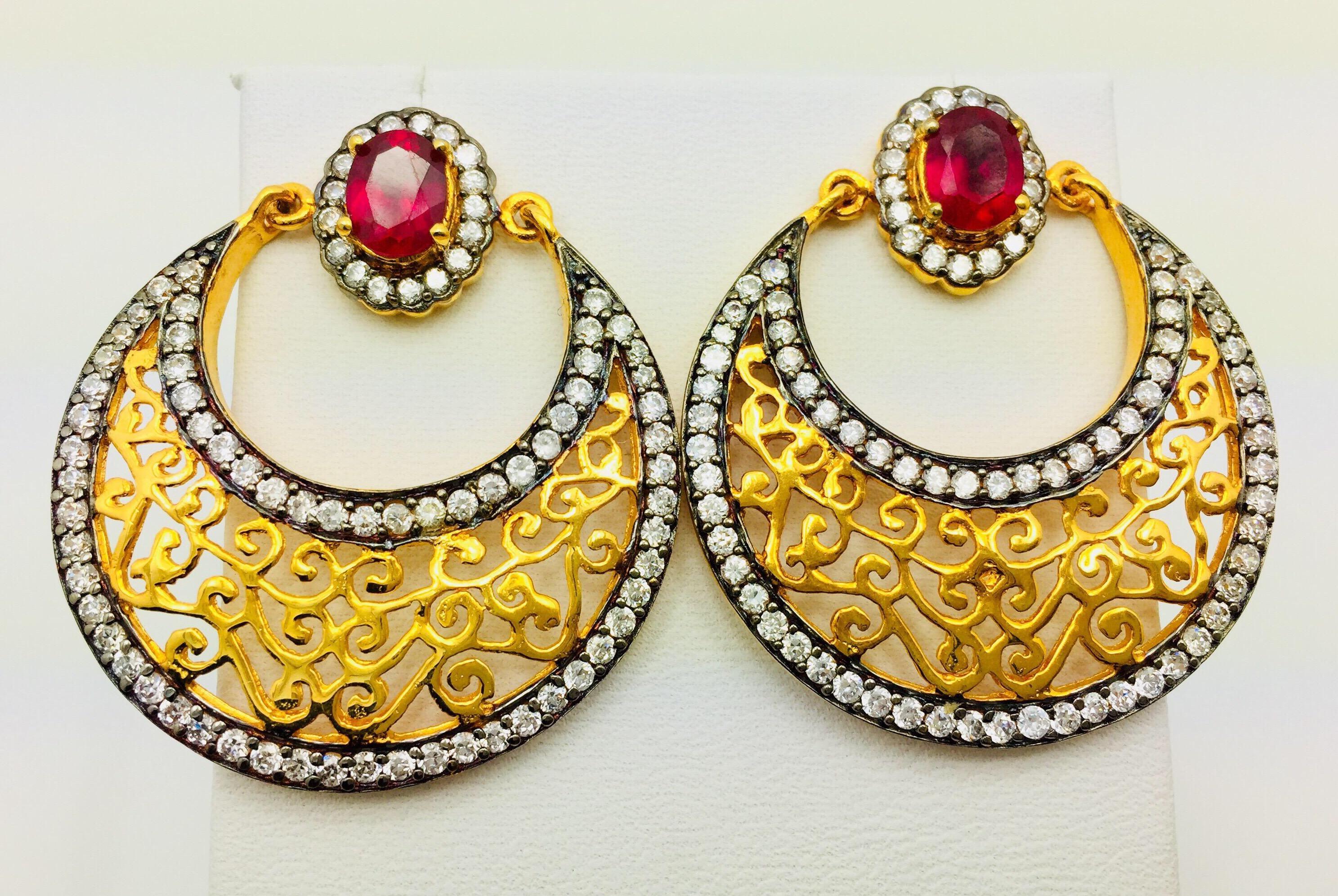 These gorgeous gold and filigree earrings are the ultimate in exotic glamour. With intricate gold filigree, faux ruby and CZ stones delivers unmatched sparkle. Earrings have a post closure for pierced ears.

1 available.  A short video available for