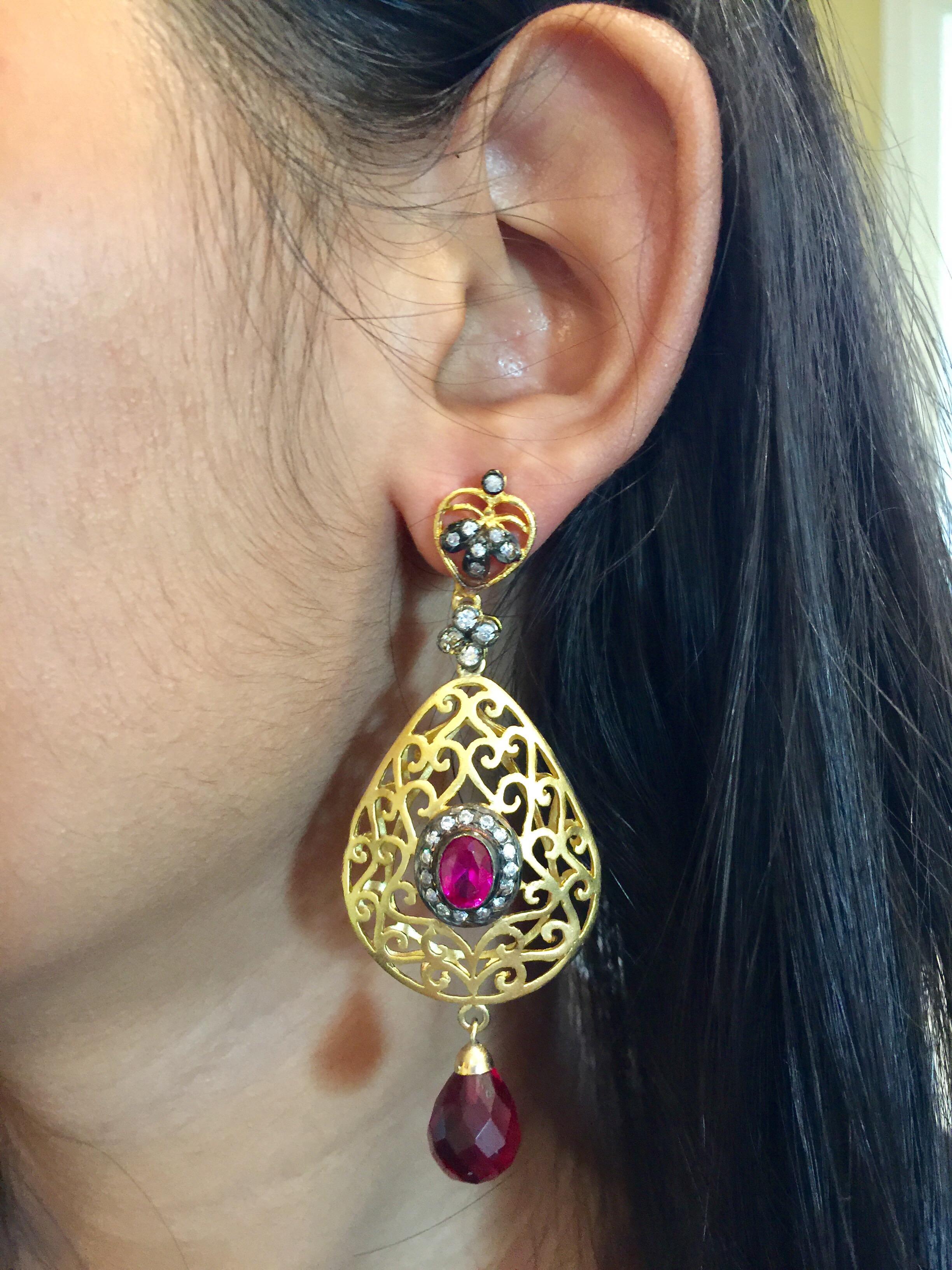 The handmade filigree faux ruby earrings is ornate and lovely, it is further enhanced by sparkling CZ stones. Earrings have a post closure for pierced ears.

Length: 2 3/4 inches
Width: 1 1/2 inches

FOLLOW  MEGHNA JEWELS storefront to view the