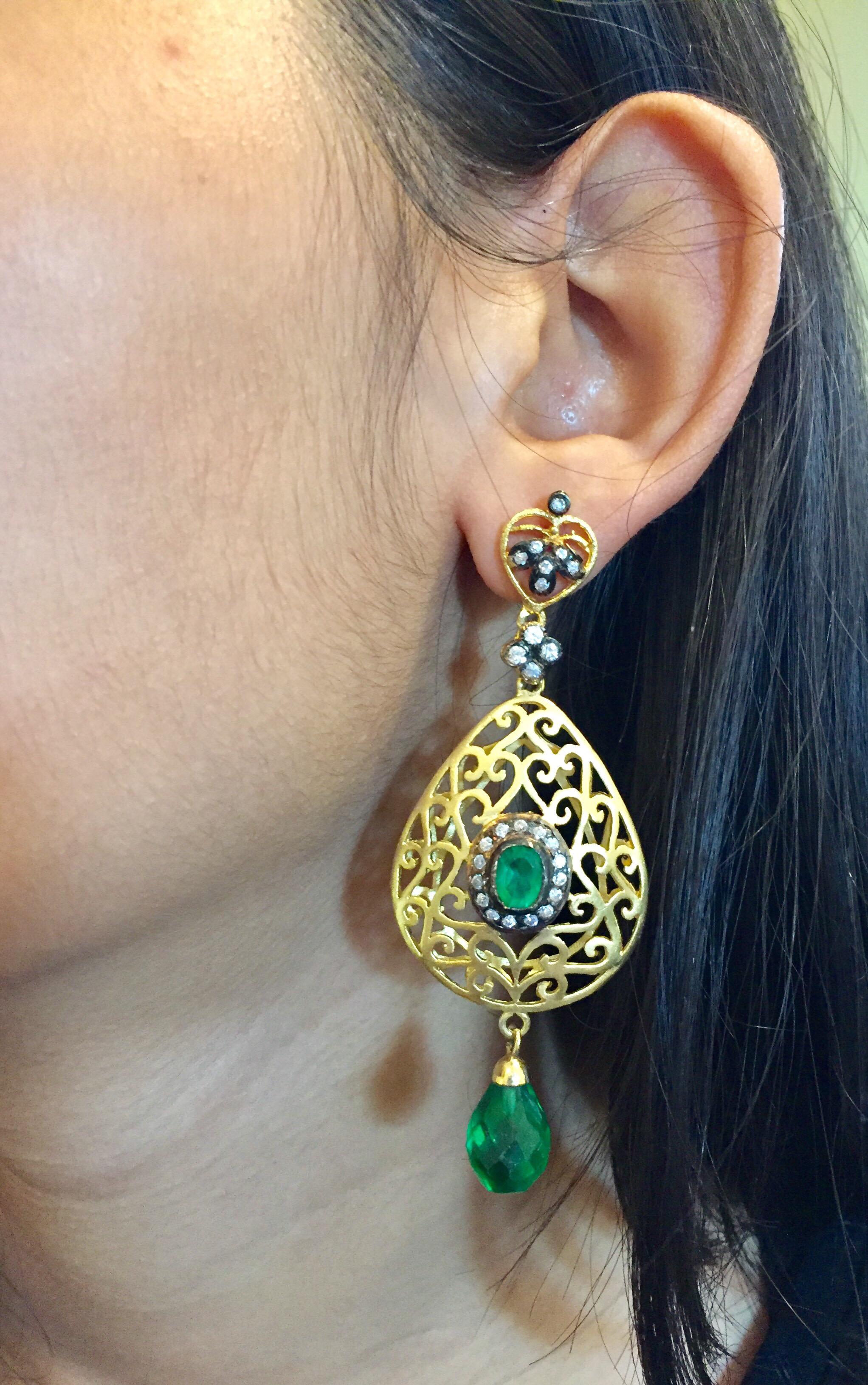 The handmade filigree faux emerald green earrings is ornate and lovely, it is further enhanced by sparkling CZ stones. Earrings have a post closure for pierced ears.

Length: 2 3/4 inches

Width: 1 1/2 inches