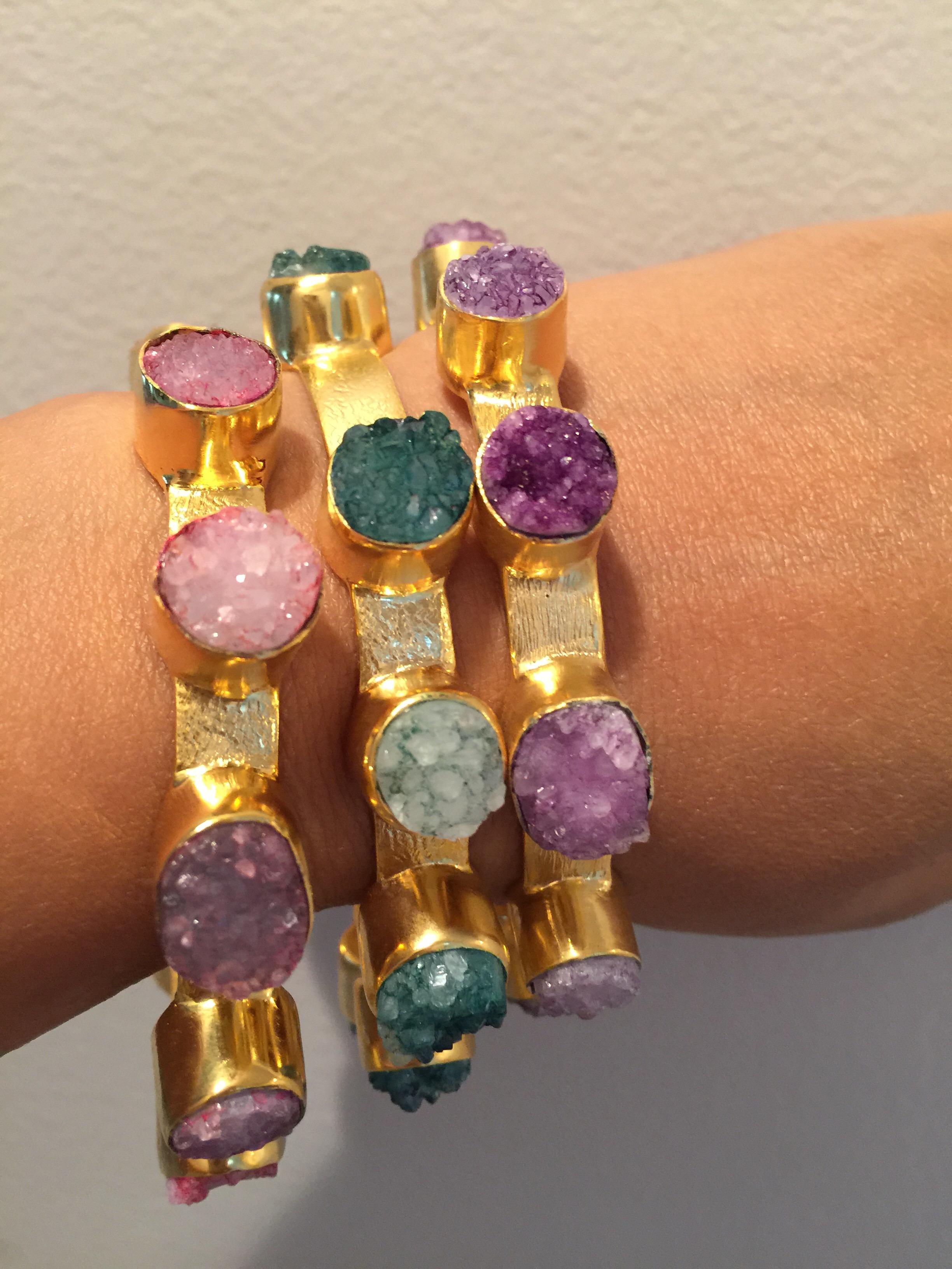Slim bangles with textured hand brushed metal enhanced with 10 colorful druzy stone all over.  Available in pink, green and purple druzy. Wear it alone or pile it on.  Sold in single piece.

Inner diameter 65.00 mm (2.56 in), inner circumference