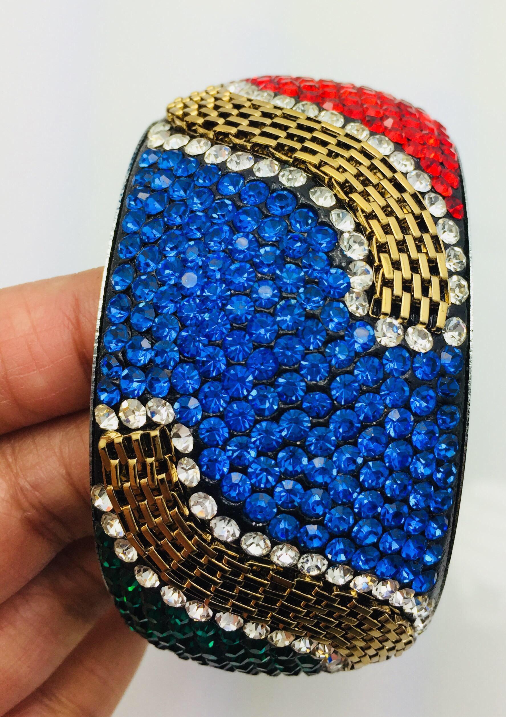 Stunning Slip On bracelet embellished with bright color red, blue, green and magenta crystals and rhinestone. Further enhanced with gold chain. Only 1 available.
Inner diameter 65.00 mm (2.56 in), inner circumference 204.2 mm (7.04 in)

FOLLOW 