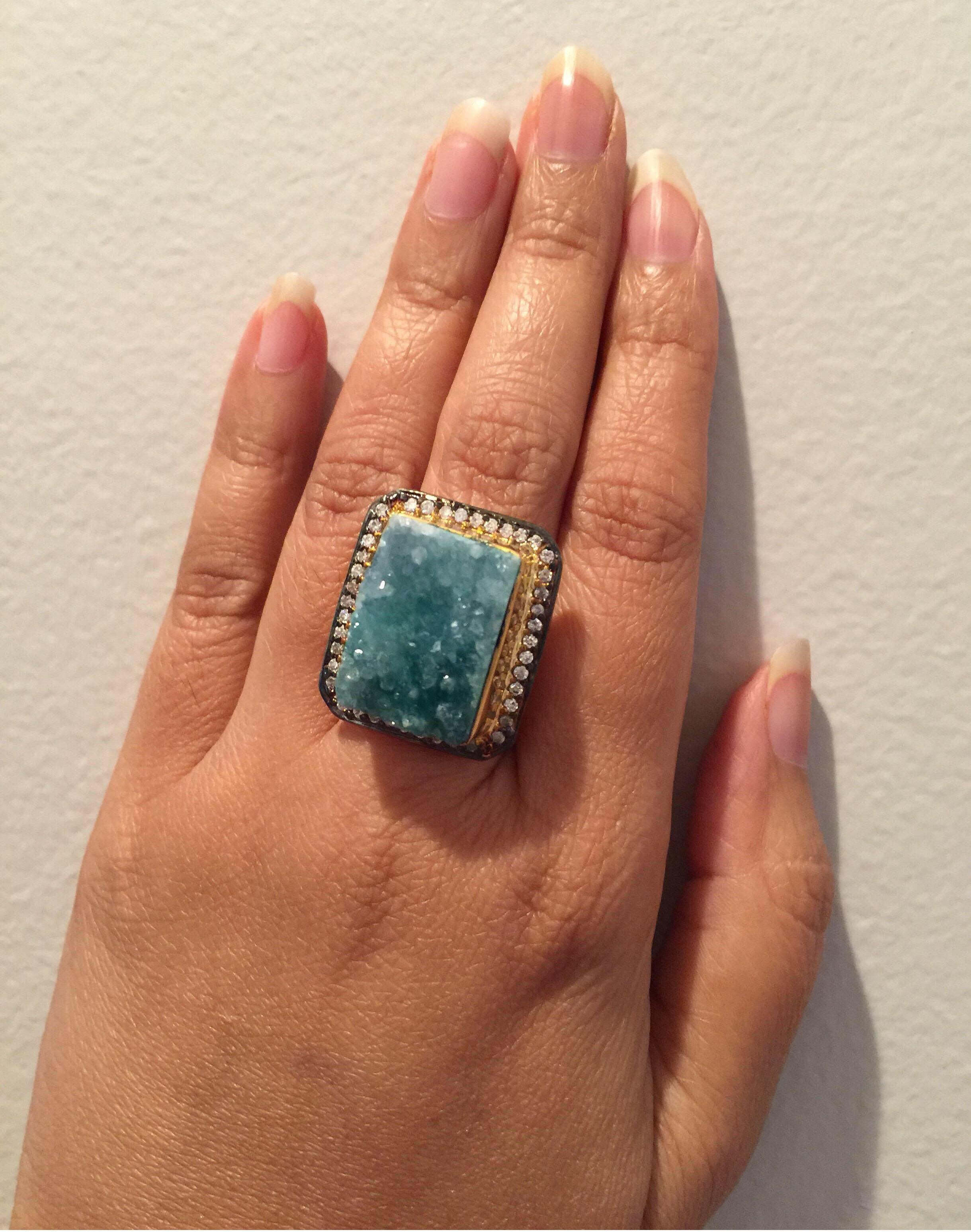 A brilliant textured druzy sits surrounded by sparkling CZ stones. Ring size 7 & 8.  Available in square & round blue, green and white druzy. Limited Stock.
Metal: 18K Gold plated

FOLLOW  MEGHNA JEWELS storefront to view the latest collection &