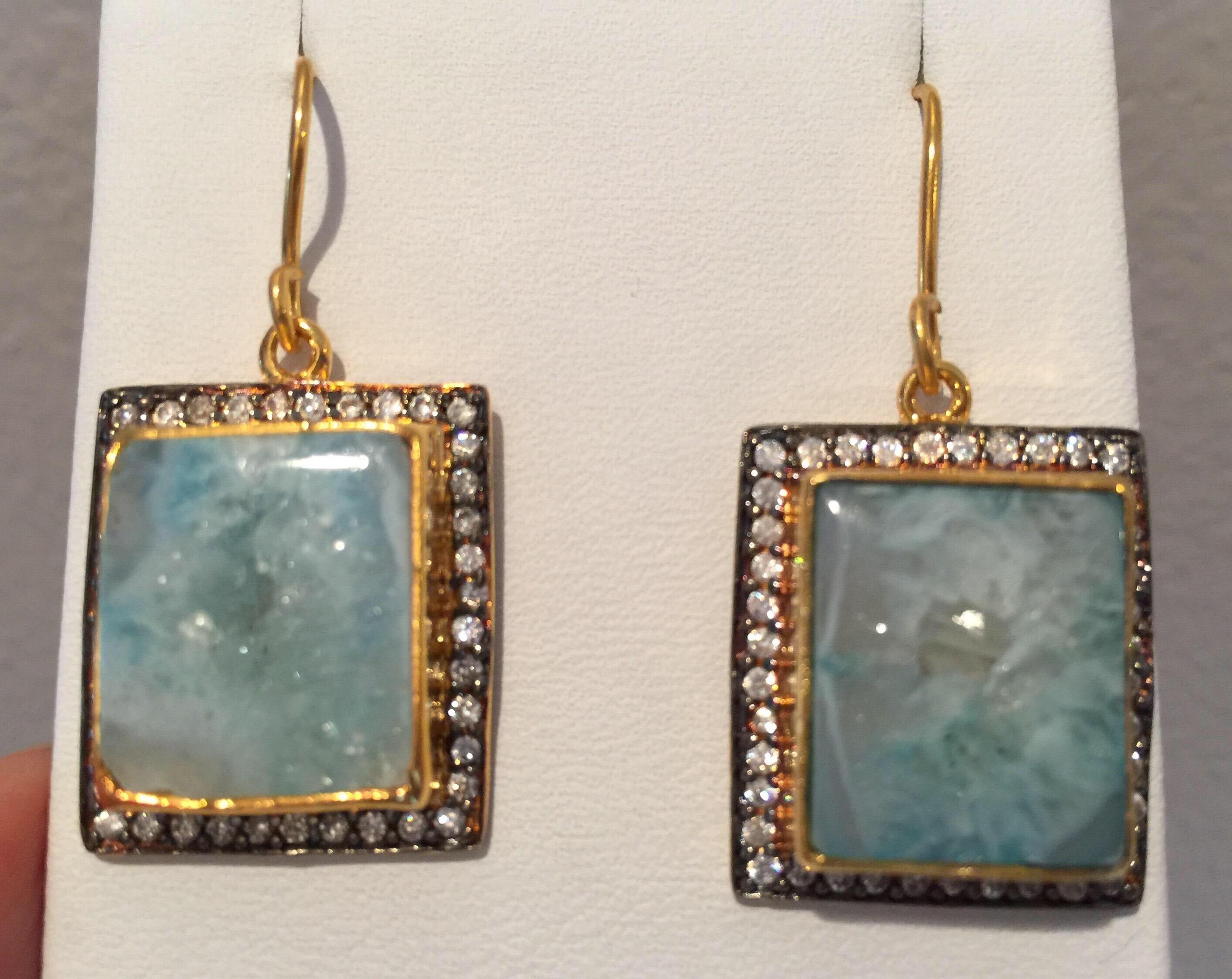 Single drop druzy earrings features slice geode in aqua blue.  Embellished with cubic zircon with fish hook closure.  Only 1 available.  18K Gold Plated.

FOLLOW  MEGHNA JEWELS storefront to view the latest collection & exclusive pieces.  Meghna