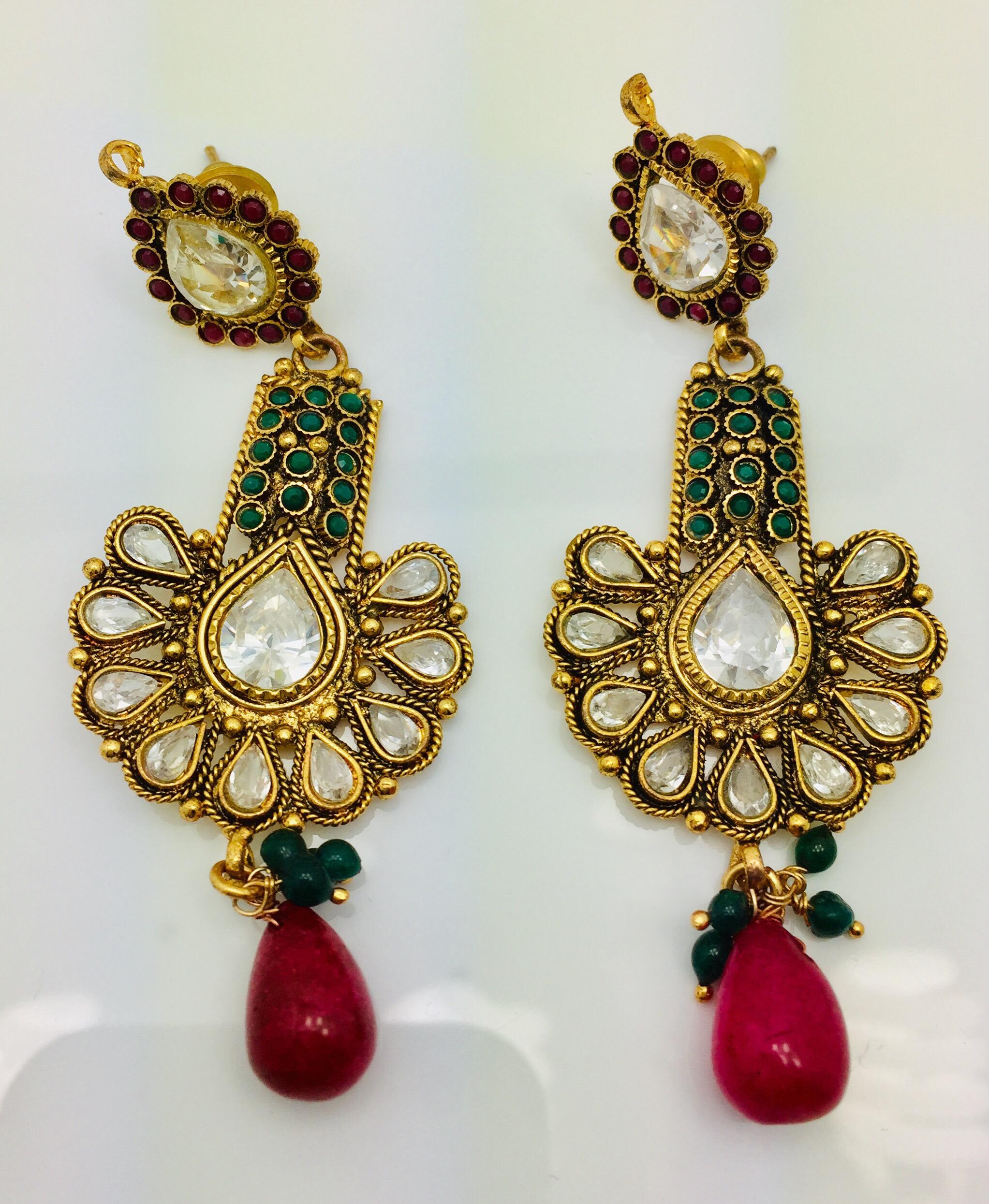 The handmade antique style red & green earrings is ornate and lovely, it is further enhanced by sparkling CZ stones. Earrings have a post closure for pierced ears.  
Length 2 1/2 inches

FOLLOW  MEGHNA JEWELS storefront to view the latest collection