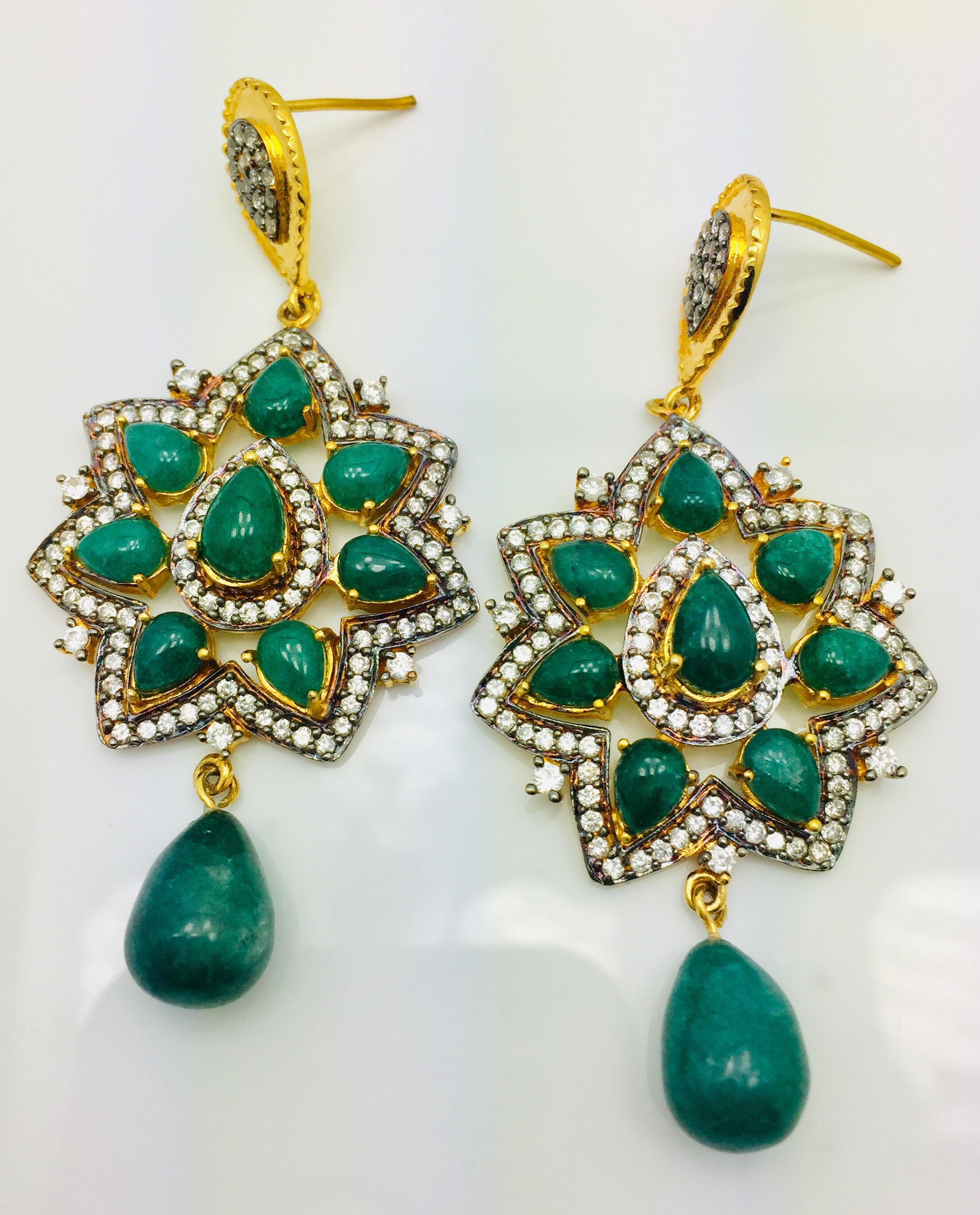 The Taj Mahal inspired design is ornate and lovely, and the striking green quartz stone is further enhanced by sparkling CZ stones overall. Earrings have a post closure for pierced ears.  Only 1 left.

Worn by Kelly Rutherford in 