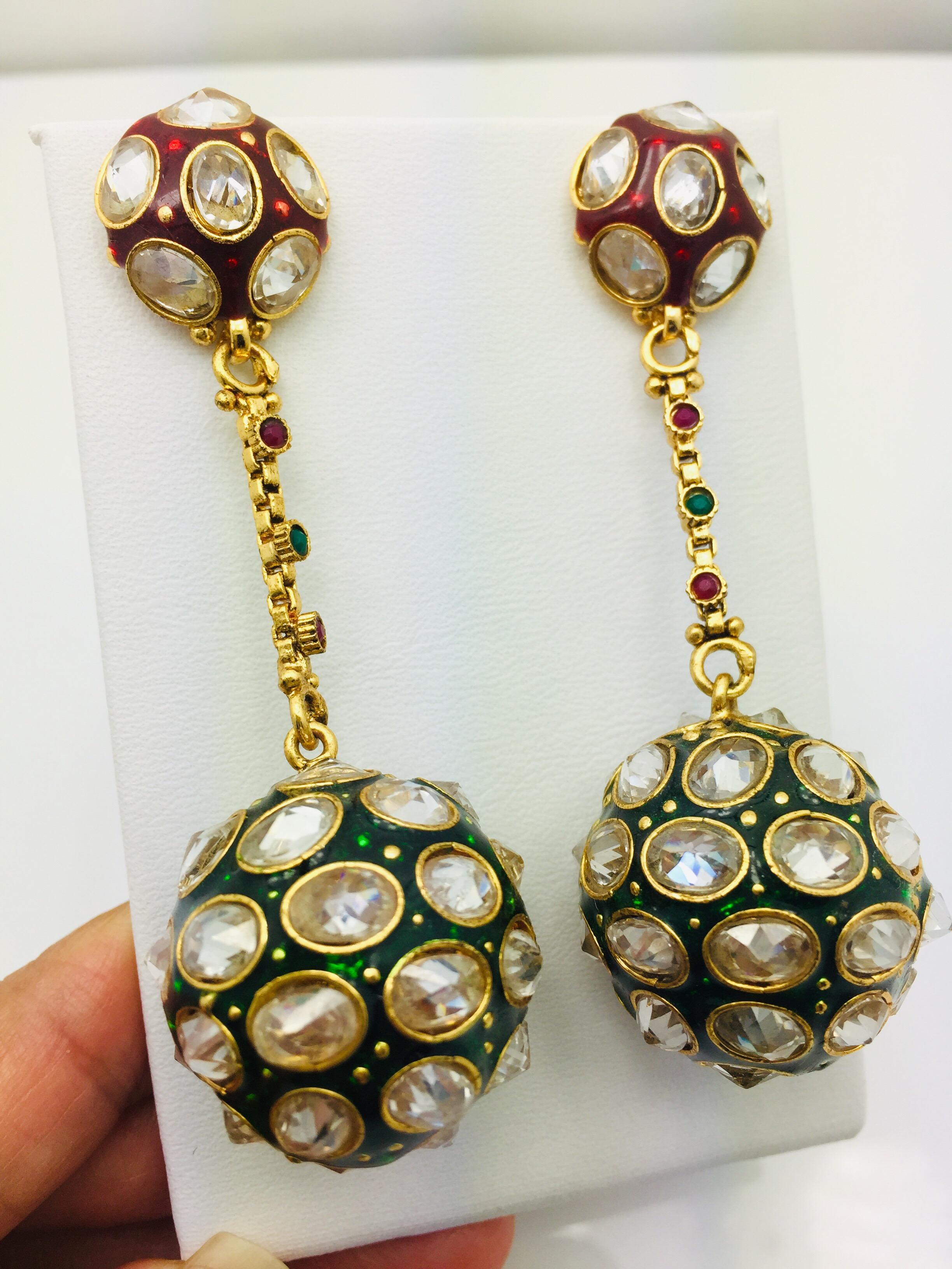 This Enamel Crystal Sphere Earrings offers an easy way to to tap the trend. They're made with a bubble-like stud that secures with a post-back fastening, and embellished with glass crystals and a sphere drop. Let them swing over a dress for a night