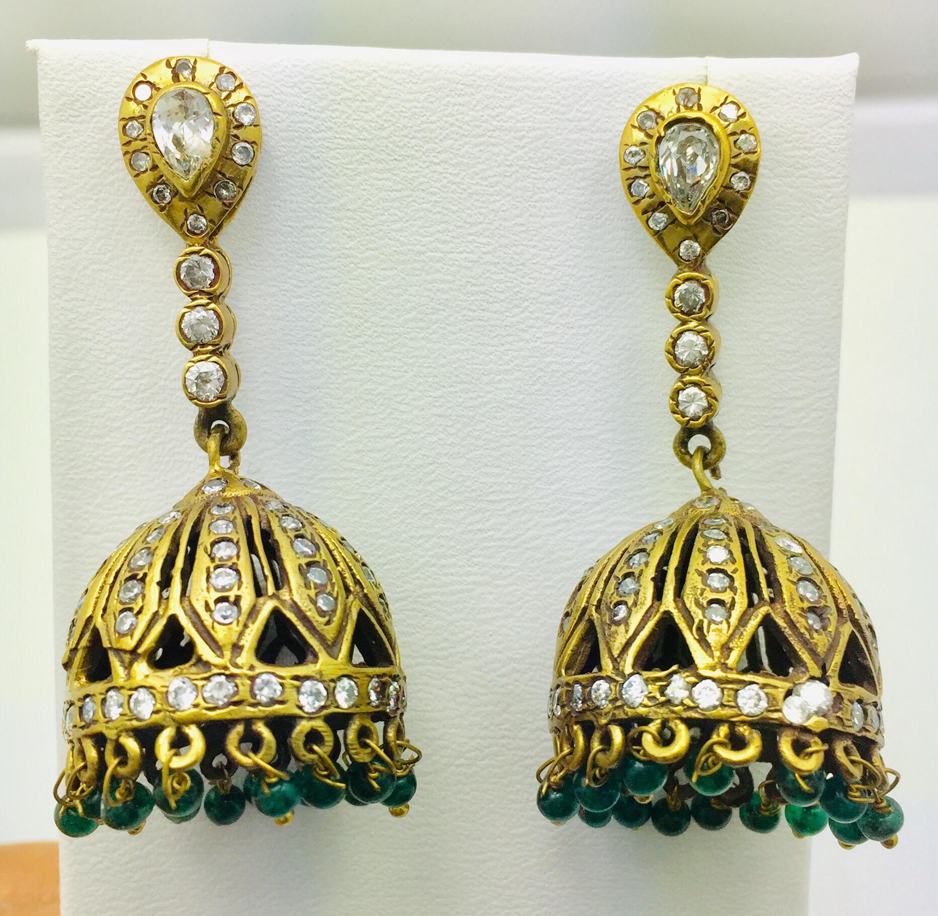 This dome shaped tassel drop earrings is enhanced with green beads.  They have varying pave crystal embellishments  Let them swing above a lace blouse for a ladylike look.

Metal: 18k gold plated
Stone: Green beads, cubic zircon
Length: 2 1/2