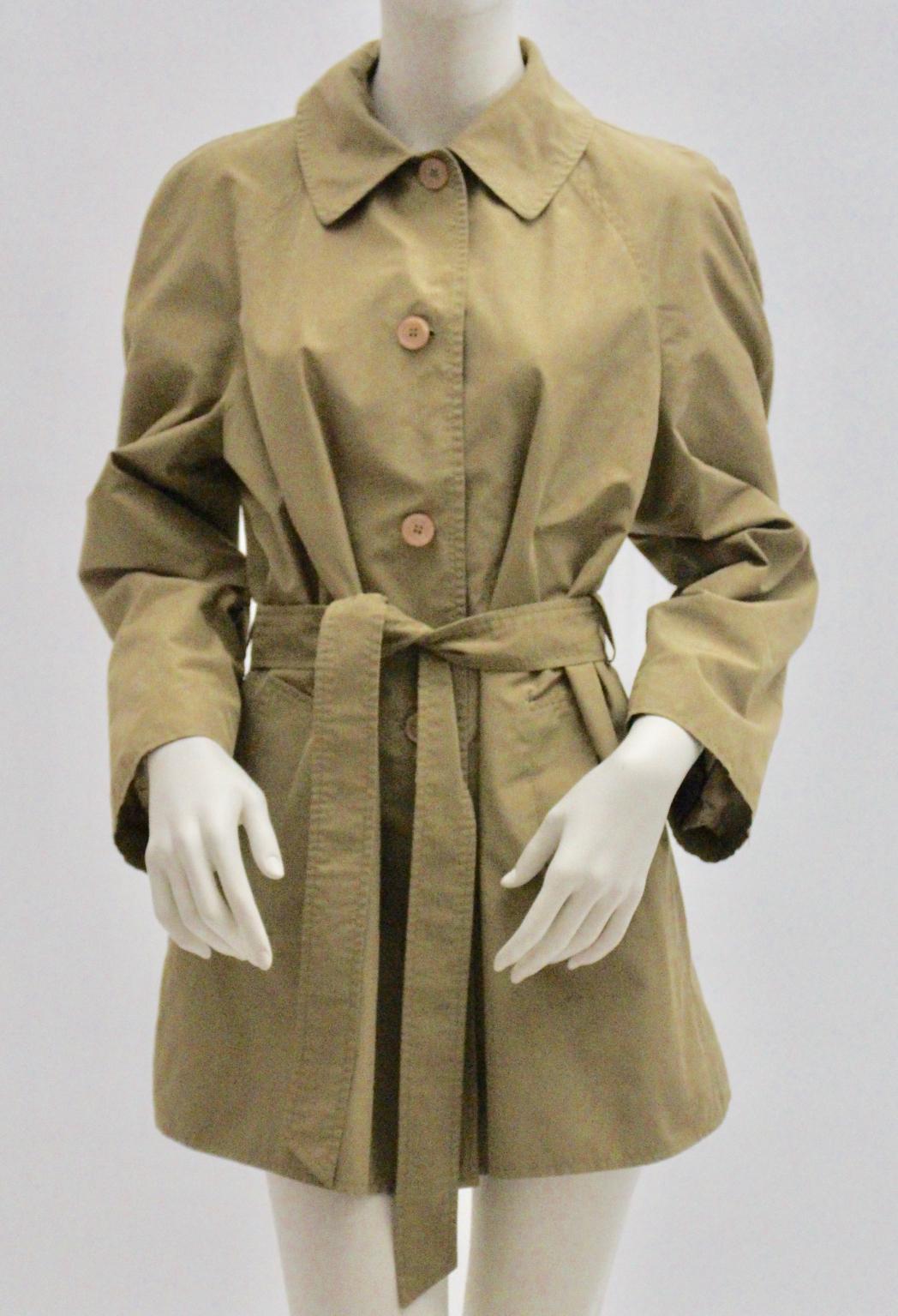 This trench was designed by Alberta Ferretti, Italy.
The Coat has 4 buttons for closure and 1 belt.

Two side pockets and raglan sleeves feature this trench coat.
Fully lined.

Size: 40 best fit for small / medium
The coat is professionally