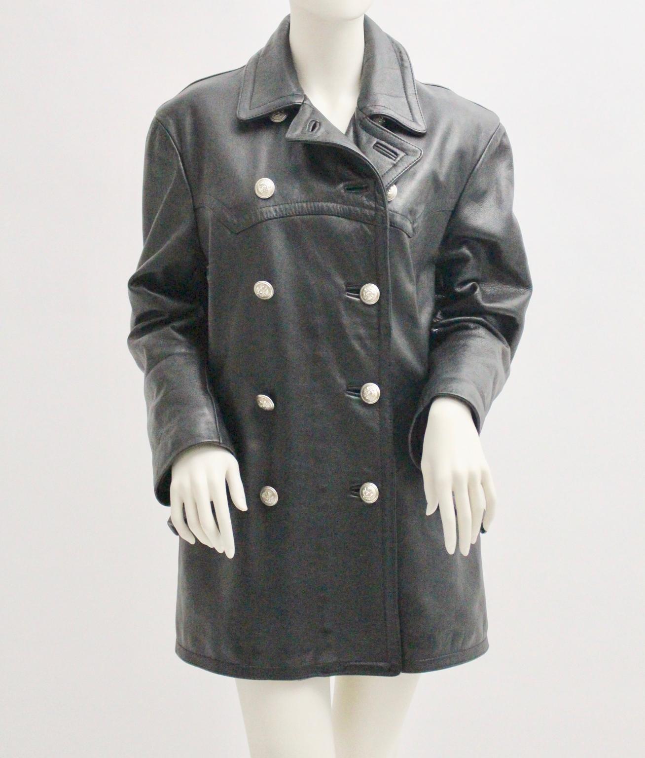 This vintage piece is a top quality double breasted leather jacket, which was designed by Jil Sander and made in Italy.

The black Jacket has a double breasted button closure and two side pockets, 
also close with two silver buttons. 
The leather