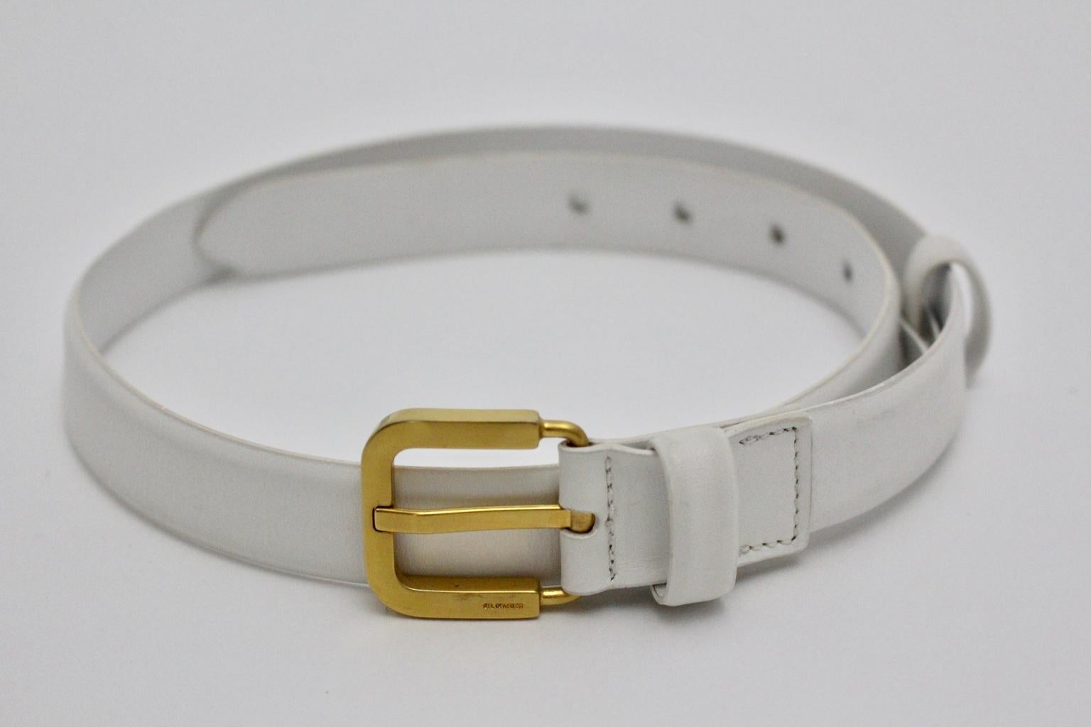 This presented leather belt was designed by Jil Sander in the 1990s.
The clean style belt was made of an engraved leather belt with a belt buckle. Furthermore the belt buckle was made of brass and shows also the engraved label by Jil Sander.
The