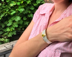 1.35 carat Peridot with 24 karat gold trims Geometric Silver Bangle Bracelet