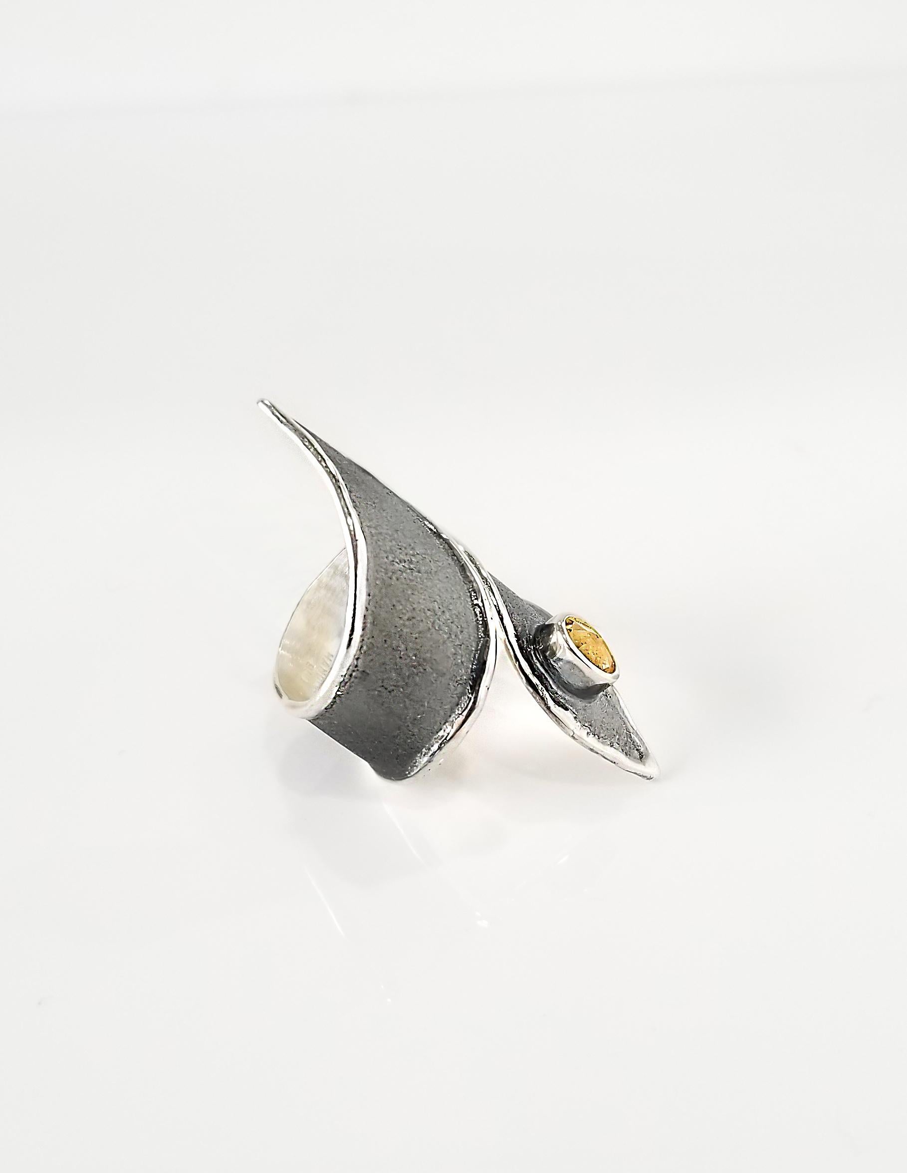 Yianni Creations 100% Handmade Ring from Fine Silver. Ring feature0.45 Carat Oval Citrine contrasting with unique oxidized Rhodium background. The ring is complemented by unique techniques of craftsmanship - brushed texture and nature-inspired