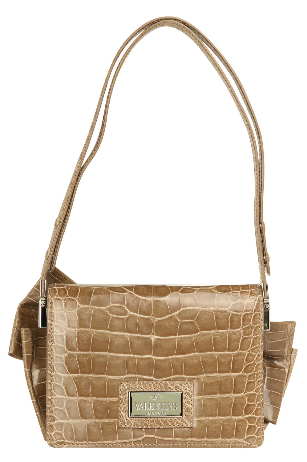 Item number 6WB00620-ACOD03-T47
Color taupe
Material Alligator leather
Lining leather
Compartments: 2 main compartments, 2 zipper pockets, 2 pockets
Dimensions width: 22 cm, height: 16 cm, depth: 8 cm
Closure Magnetic snap closure
Weight in grams