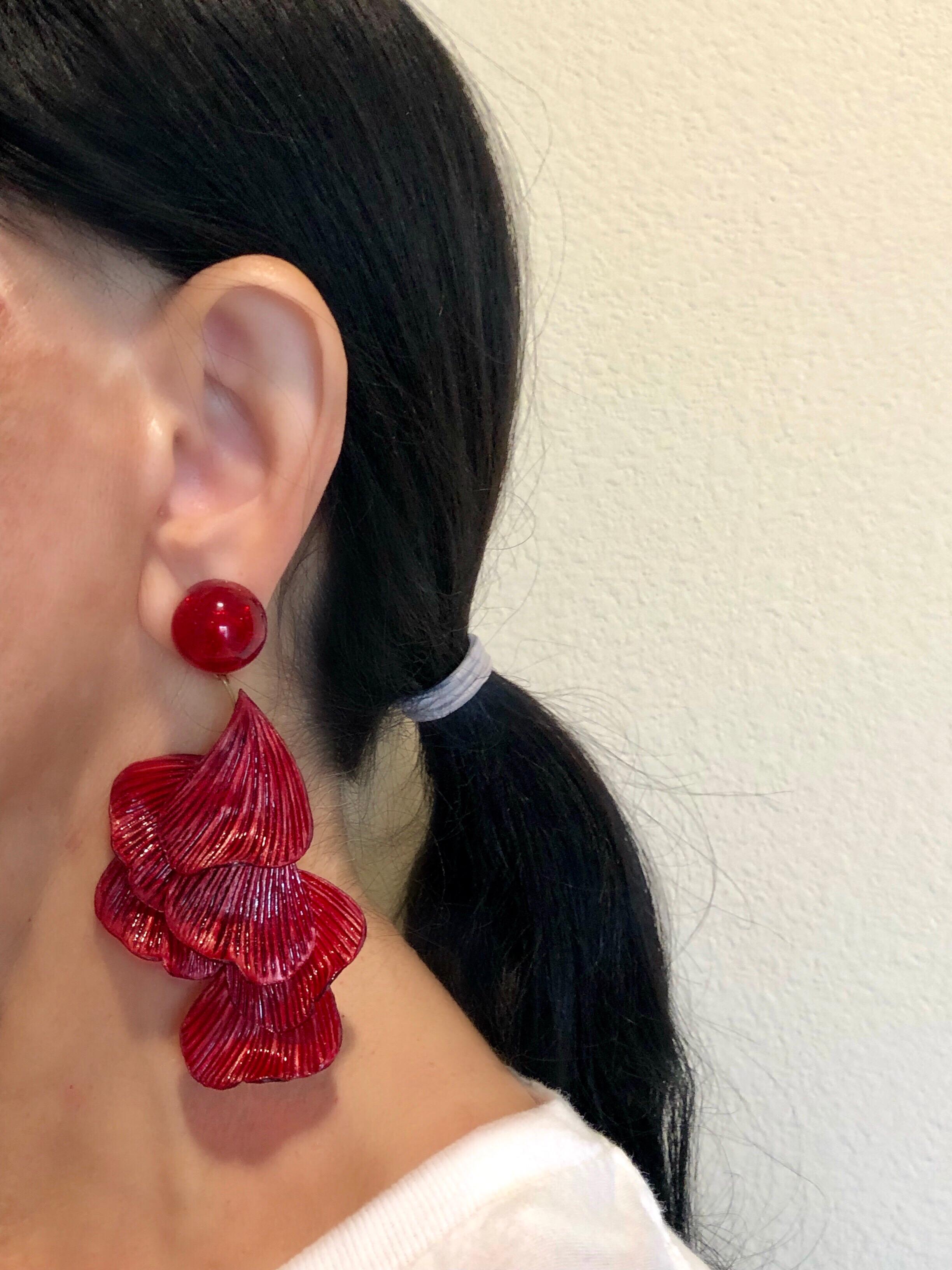 Light and easy to wear, these handmade artisanal pierced earrings were made in Paris by Cilea. The lightweight clip-on earrings feature molded wave segments of enameline (enamel and resin composite) in deep red, almost resembling whimsical fish