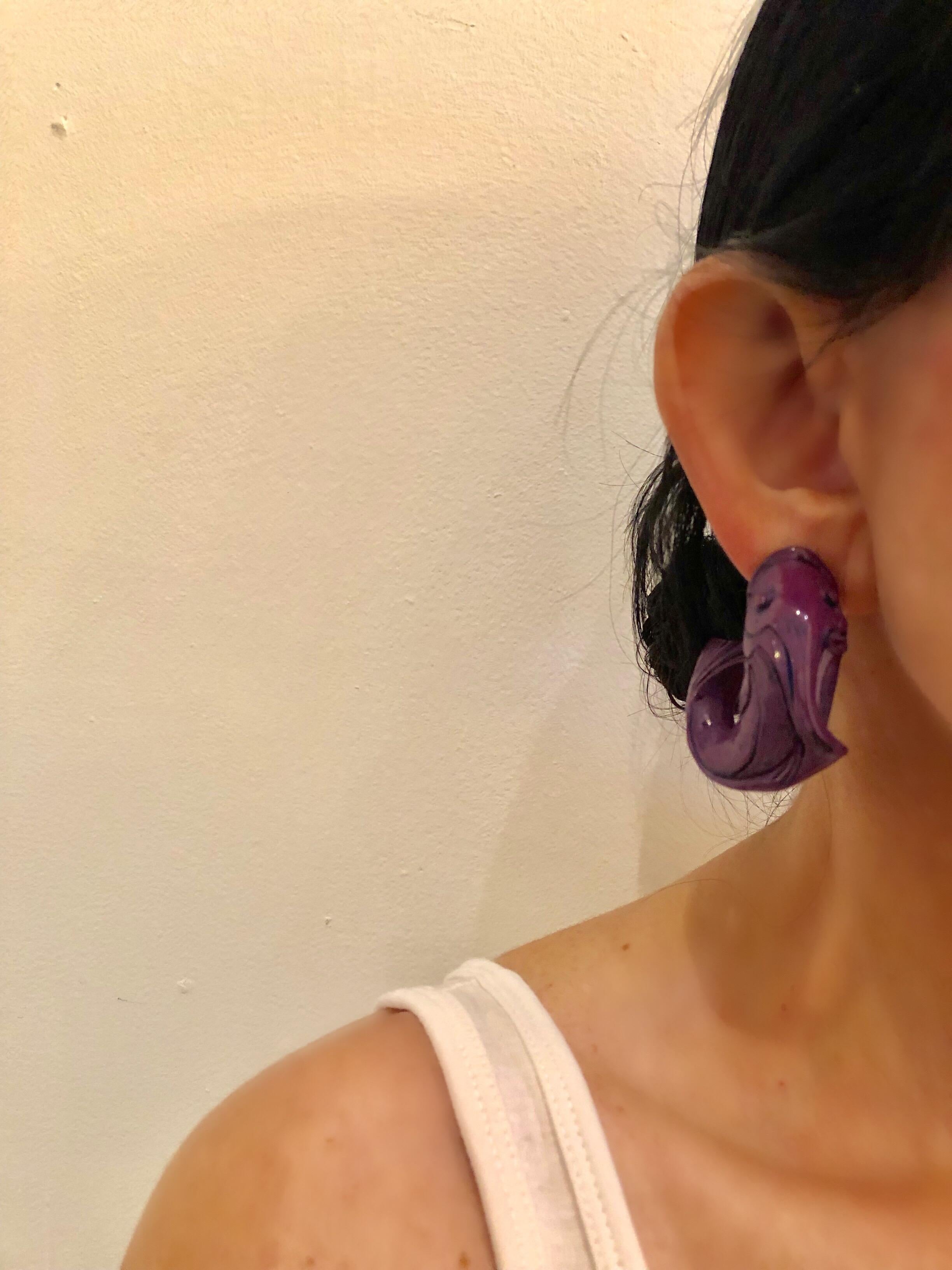 Vintage high-fashion purple statement earrings made in Paris c.1980's - the architectural statement earrings are comprised of highly carved purple resin and depict a fish. The overall design is very unique, edgy and fashion current - the clip-on