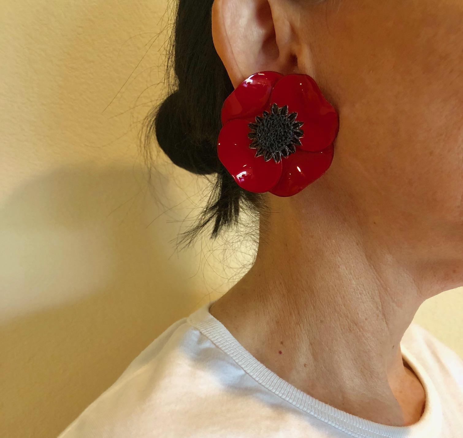 Light and easy to wear, these handmade artisanal clip-on earrings were made in Paris by Cilea.  The lightweight clip-on earrings feature a single architectural enameline (enamel and resin composite) red poppy flower. The poppies are oversized and