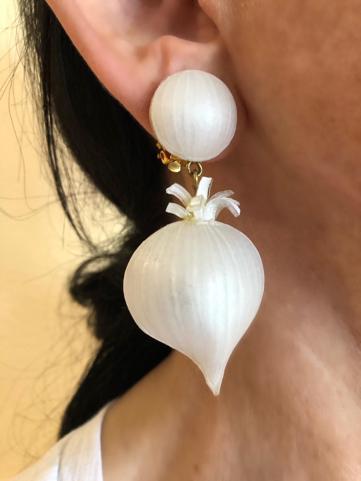 Light and easy to wear, these handmade fashion forward artisanal clip-on earrings were made in Paris by Cilea. The earrings feature two detailed and whimsical enameline (enamel and resin composite) garlic cloves. Very Parisian, the French are known