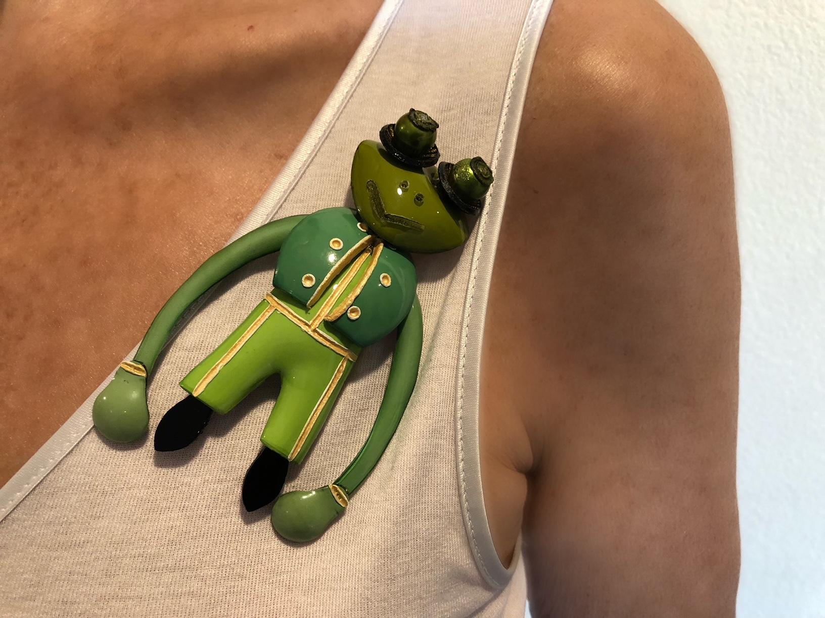 Light and easy to wear, this handmade artisanal brooch/pin was made in Paris by Cilea. The pin is comprised of green enameline (resin and enamel composite) and depicts a frog. Throughout the pin you can see the attention to detail Cilea is known