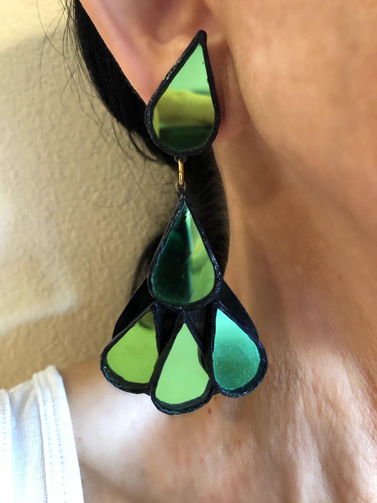 Elegant 1970s - 1980's talosel resin artisanal statement clip-on earrings by Irina Jarworska, Paris. Rare black resin talosel earrings with green encrusted tinted mirrors. Irina was a student who attended Line Vautrins school in Paris where she