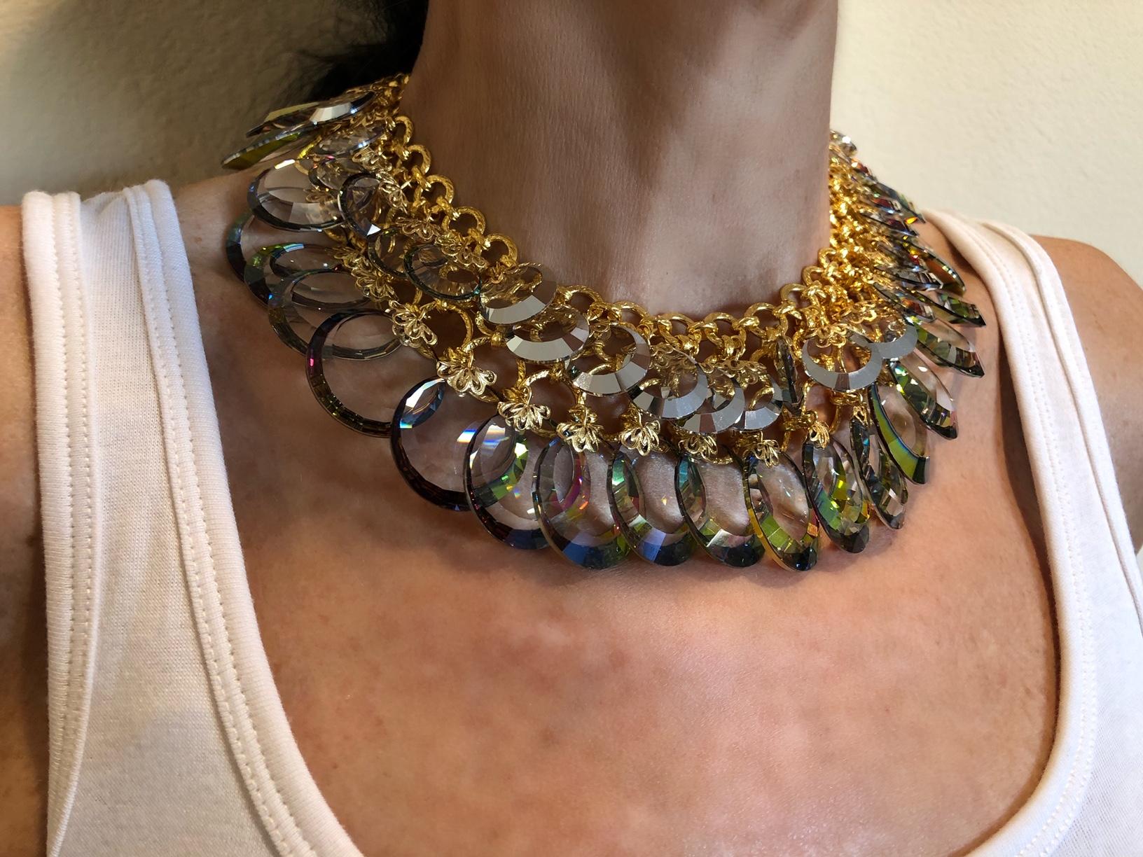 Simply gorgeous! This spectacular French haute couture necklace was created in Paris by the house of Francoise Montague - comprised of a thick and wide gold-tone metal chain the necklace features two rows of UNUSUAL antique circular Austrian