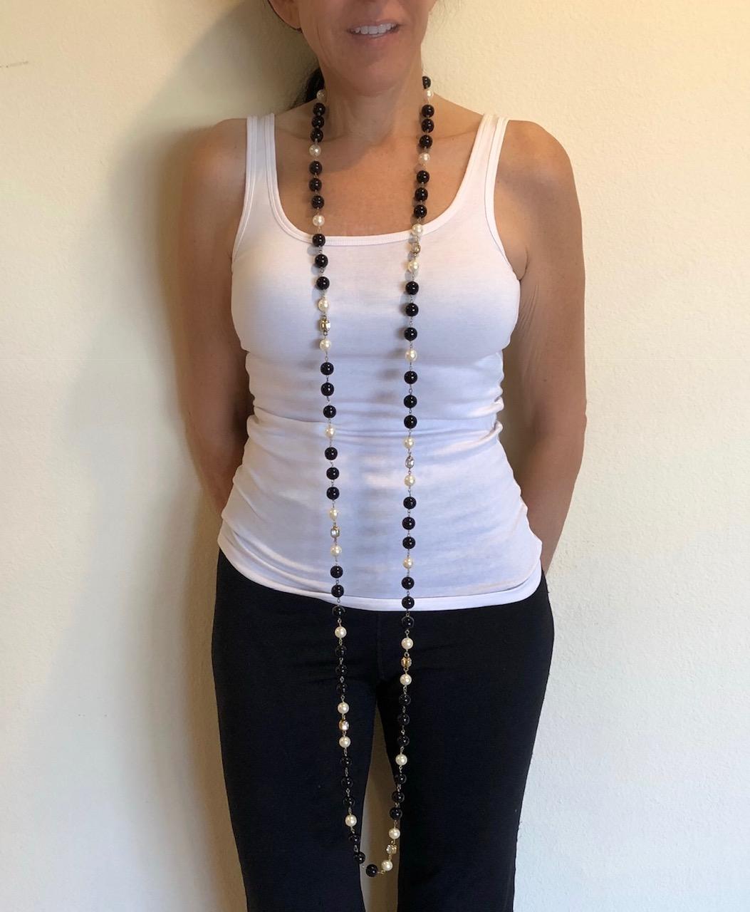 Scarce vintage Chanel sautoir necklace made in France, 1994 A collection (autumn) - the long statement necklace features large black beads and creamy white pearls. In all Coco Chanel manner, the necklace is accented by large diamante stones set in