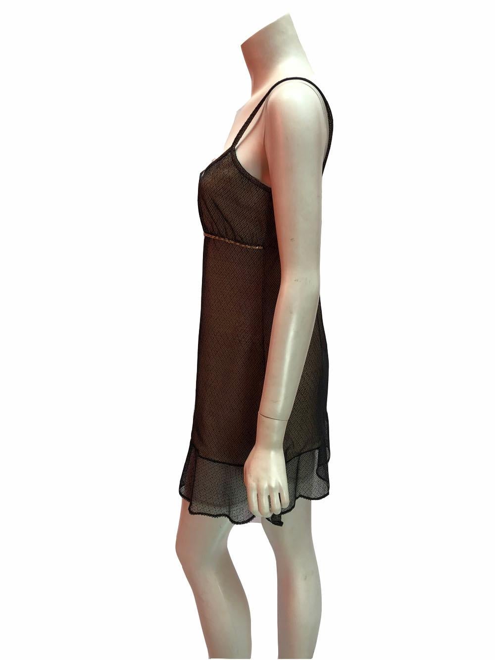 Chanel, vintage,  babydoll style slip dress in nude with black mesh overlay and chain accent under the bust. Spaghetti straps and ruffle bottom. Absolutely adorable. Very hard to find and can be worn at many sizes. 
Excellent condition. 
Size 8/10 