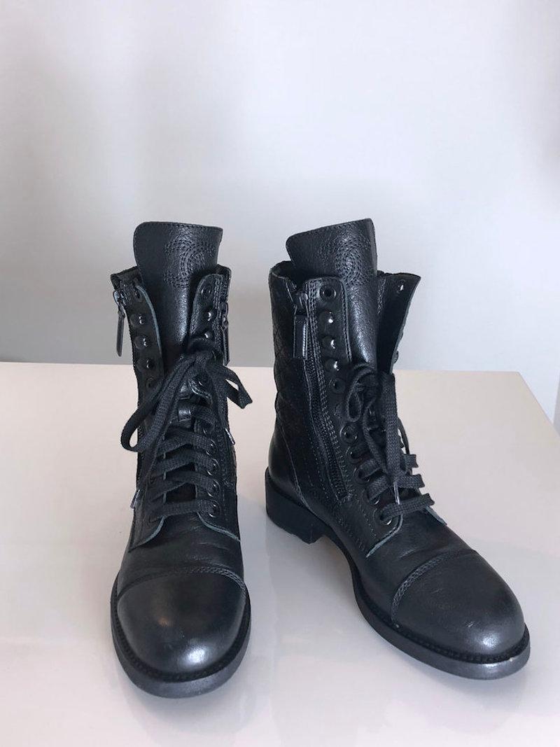 Chanel black leather quilted combat boots with side zips. CC embroidered on the tongue. 

Size 37.

Retail price: $1500

Excellent condition with small scuff mark on one toe. 